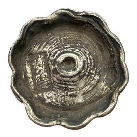 A RARE 10-TAEL 'FLOWER-EDGED' CIRCULAR SILVER INGOT (SYCEE)GUIYANG, GUIZHOU PROVINCEQING DYNASTY