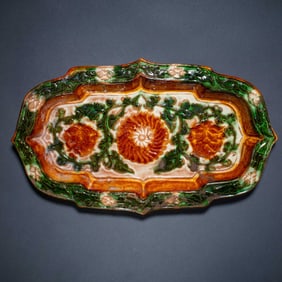 A MAGNIFICENT AND RARE 'SANCAI' GLAZED MOLDED 'FLORAL' DISHTANG DYNASTY (618–907)