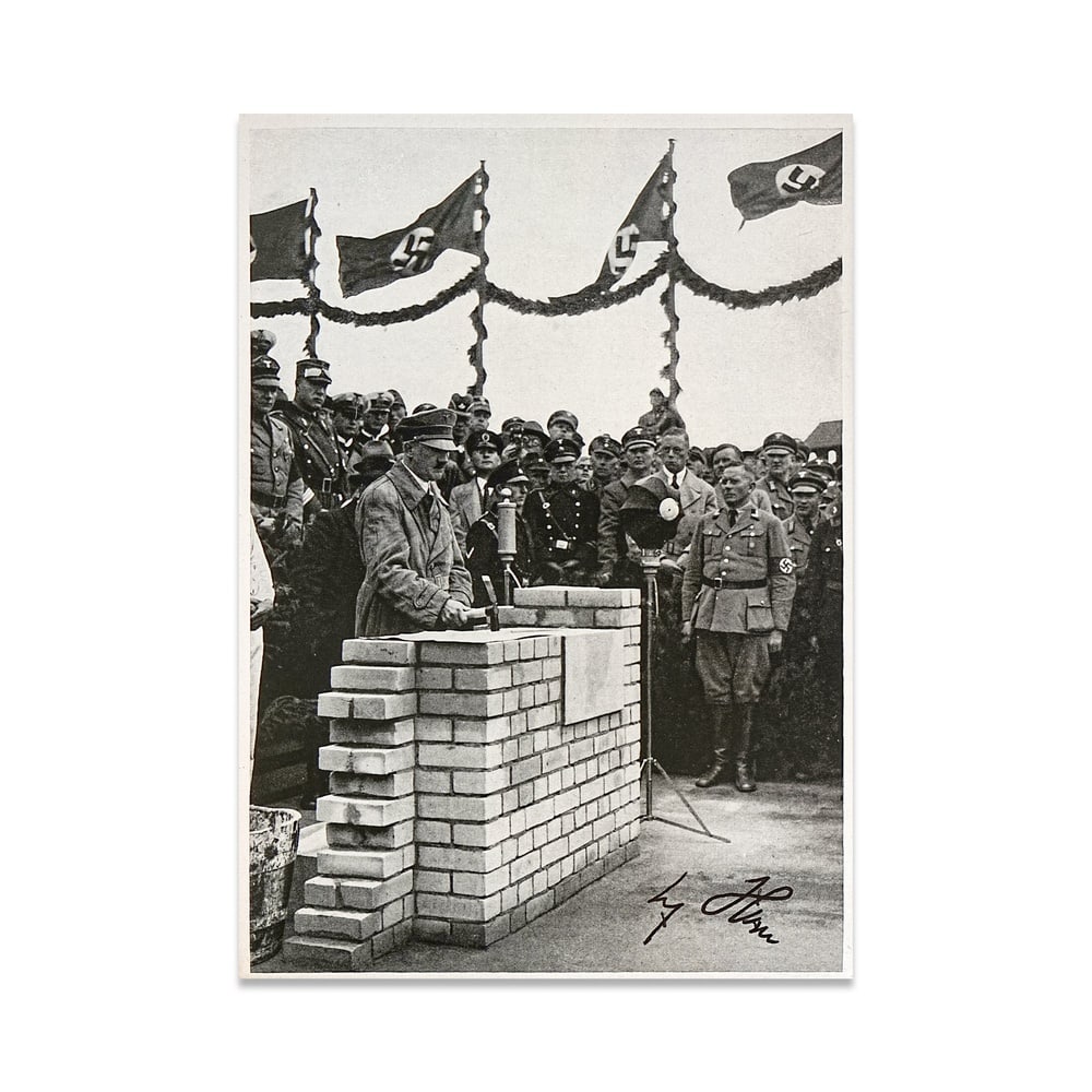 ADOLF HITLER SIGNED PROPAGANDA PHOTO CARD(FOUNDATION CEREMONY SCENE): 6 5/8 x 4 5/8 in (16.8 x 11.8 cm) Provenance and Authentication: This collectible has undergone a rigorous forensic evaluation. The signatures were carefully analyzed across multiple criteria, includi