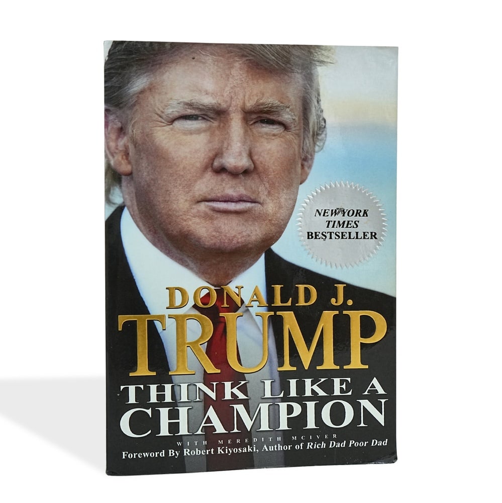 DONALD J. TRUMP SIGNED "THINK LIKE A CHAMPION" FIRST EDITION FIRST PRINTING: 8 1/4 x 5 1/2 in (21 x 14 cm) Provenance and Authentication: This collectible has undergone a rigorous forensic evaluation. The signatures were carefully analyzed across multiple criteria, including