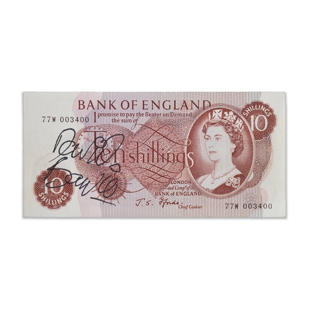 DAVID BOWIE SIGNED BANK OF ENGLAND TEN SHILLINGS NOTE: 2 5/8 x 5 1/2 in (6.6 x 13.9 cm) Provenance and Authentication: This collectible has undergone a rigorous forensic evaluation. The signatures were carefully analyzed across multiple criteria,