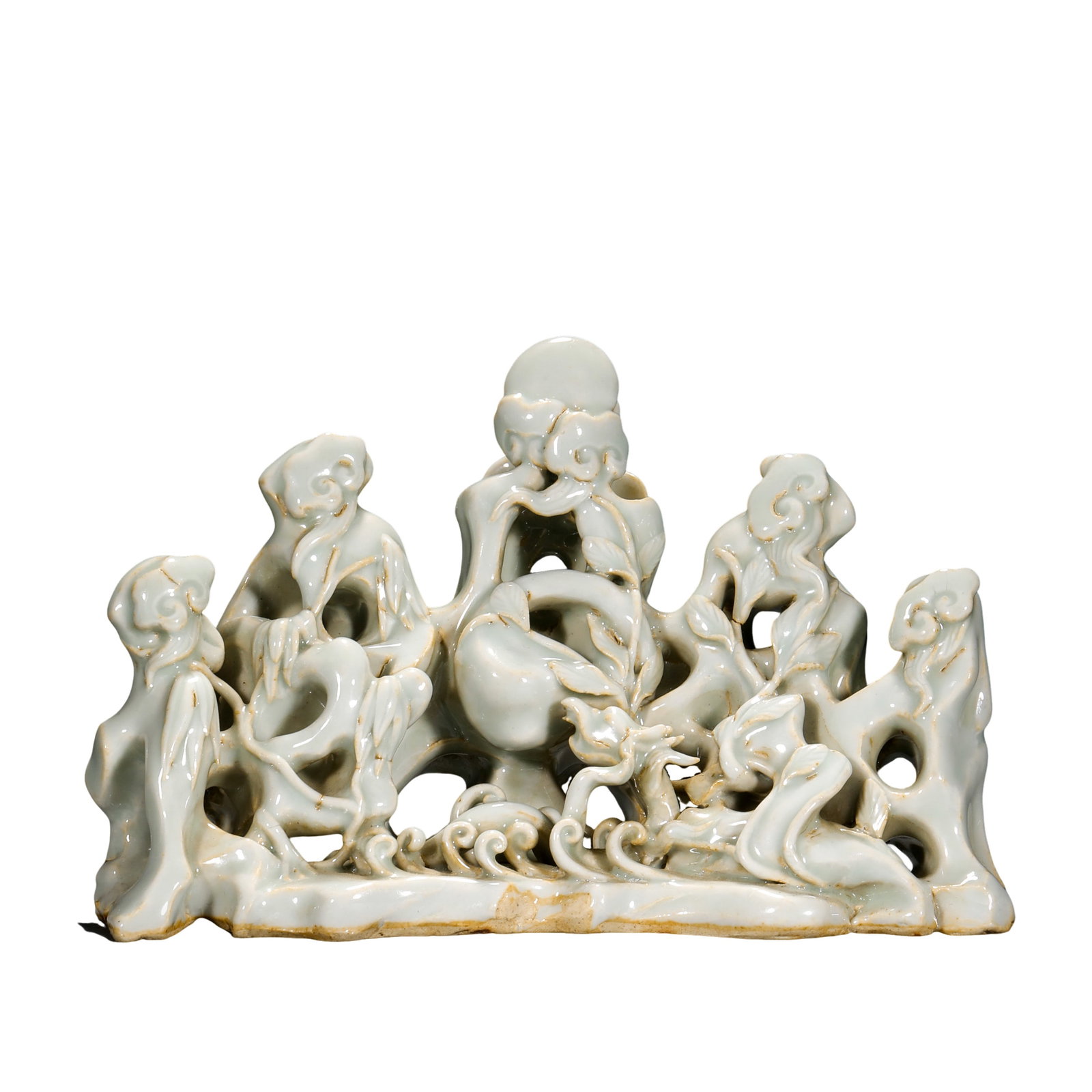Song Dynasty Qingbai-Glazed Reticulated Brush Rest with Chi Dragon, Longevity Peach, and Lingzhi: Dimensions: Approximately 12.5 cm high and 20 cm wide (about 4.9 inches high and 7.9 inches wide; about 0.41 feet high and 0.66 feet wide) 12th centuryCondition and Provenance: The piece remains in go