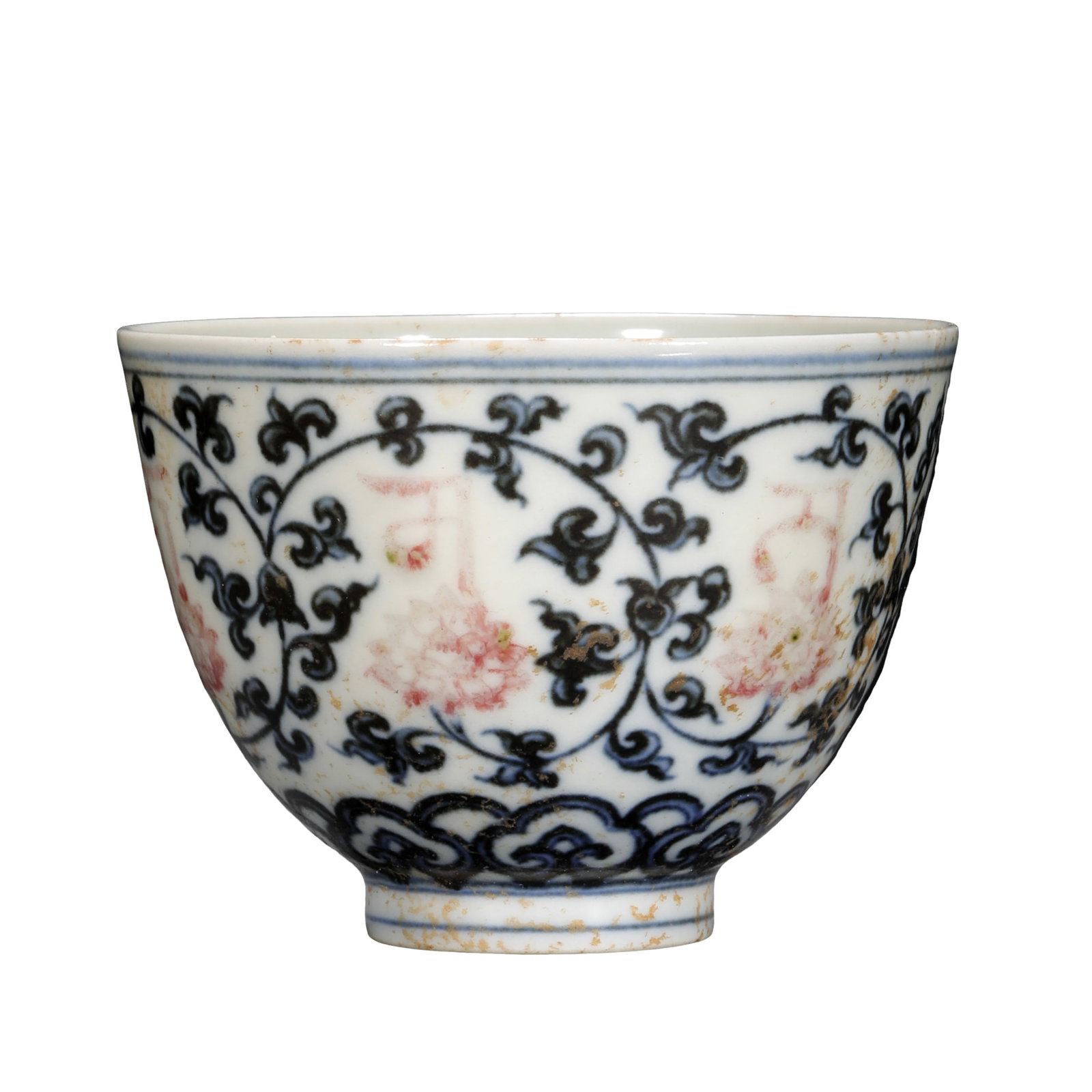 A Chenghua Period Blue and White with Underglaze Red Lotus Scroll and Sanskrit Design “Jixin: Dimensions:Height: 6 cm (2.36 in); Diameter: 8.2 cm (3.23 in); 15th CenturyCondition and Provenance: The cup remains in good overall condition with a smooth, warm glaze surface. Natural aged brownish 