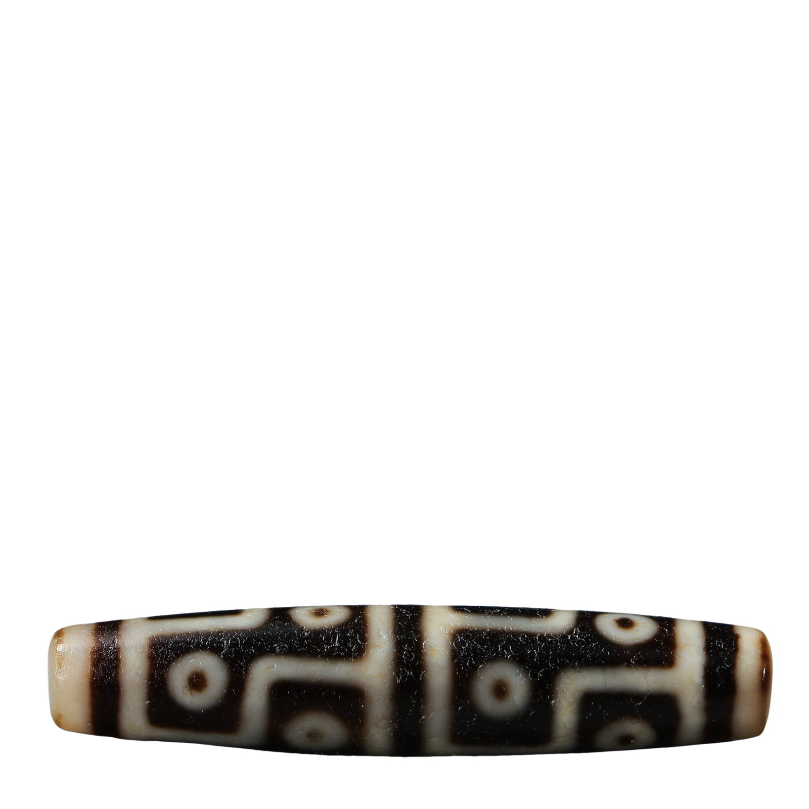 Ancient Tibetan Nine-Eyed Dzi Bead (circa 7th–10th century, Tang Dynasty to Tibetan Empire Period): Dimensions & Weight: 7th–10th century CE (Tang Dynasty to Tibetan Empire Period); Length: approx. 5.6 cm (2.20 in), Width: approx. 1.27 cm (0.50 in), Weight not provided?Condition & Provenance: The 