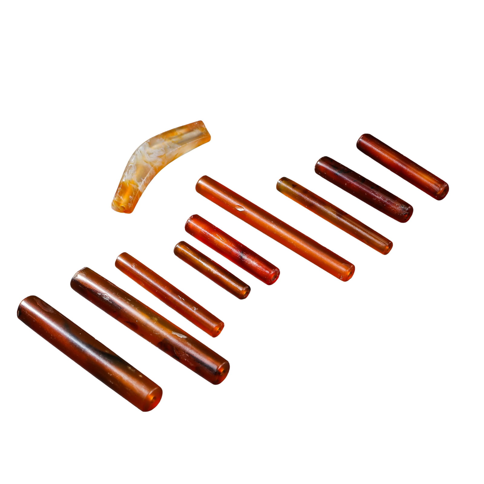 Western Zhou Dynasty Group of Nine Carnelian Tube Beads: Dimensions: 11th?8th Century BCE, Longest tube 6.7 cm (2.64 in), curved tube 4.9 cm (1.93 in), total weight 57 g Condition & Provenance: The complete set survives intact with authentic ancient surface