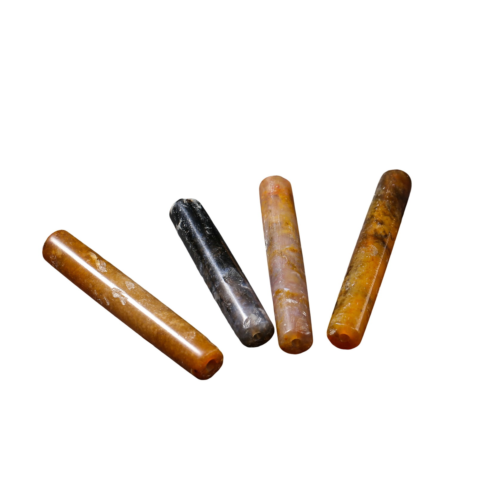 Neolithic to Zhou Period (approximately 3000 BCE–3rd Century BCE) Set of Four Ancient Hetian Jade: Dimensions: Longest tube 6.2 cm (2.44 in), total weight 48 g, Neolithic to Zhou Period (approximately 3000 BCE–3rd Century BCE)?Condition & Provenance: The group is preserved in good condition with 