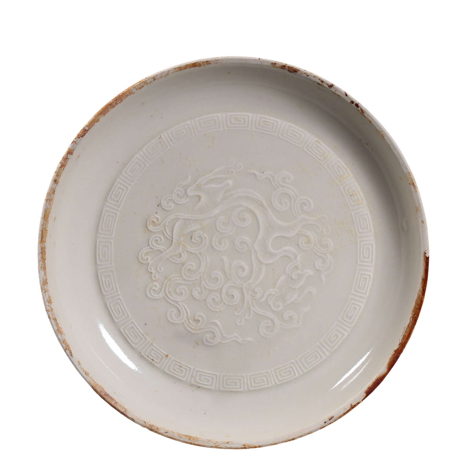 Song Dynasty White Glazed Molded Chi Dragon and Key-Fret Brush Washer: Dimensions: Song Dynasty (10th–13th Century) Diameter 14 cm (5.5 in.), Height 1.8 cm (0.7 in.)?Condition & Provenance: The piece is well preserved overall, with a smooth and refined white glaze surf
