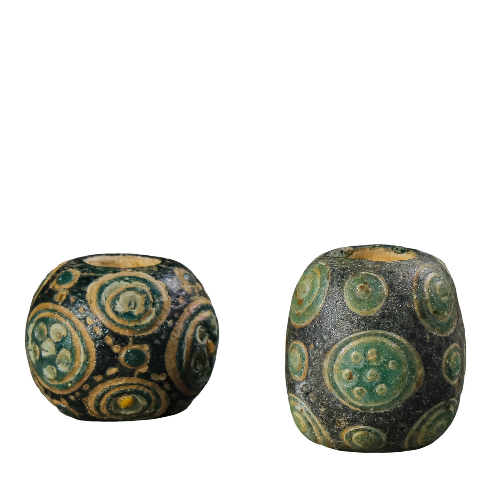 A Pair of Warring States Green-Ground Eye Beads, Ancient Chinese Glass Beads (5th–3rd century BCE): Dimensions: H. 1.8 cm and 2.2 cm (approx. 0.71 and 0.87 in), total weight 27 g (approx. 0.95 oz), Warring States Period (5th–3rd century BCE)?Condition & Provenance: Overall well preserved. Both bea