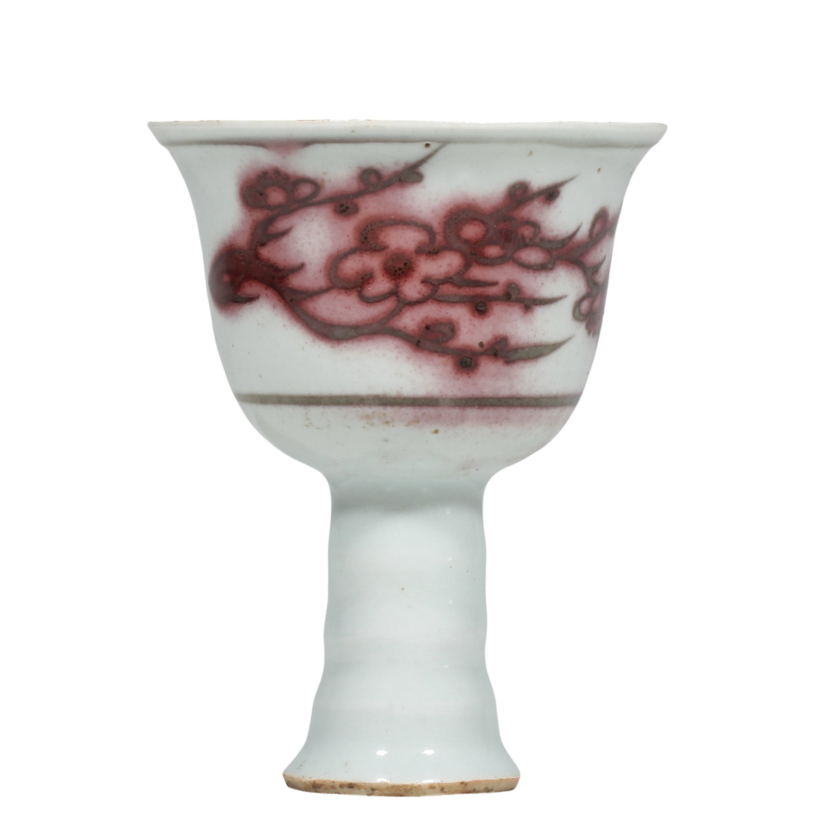 Yuan Underglaze?Red Stem Cup with Plum?Blossom Pattern: Dimensions?H.10.5cm?Diam.8.5cm Condition & Provenance?The cup is intact, without cracks and chips. Faint age?related wear observable on rim. Natural smudging and dark spots of underglaze?red, consiste