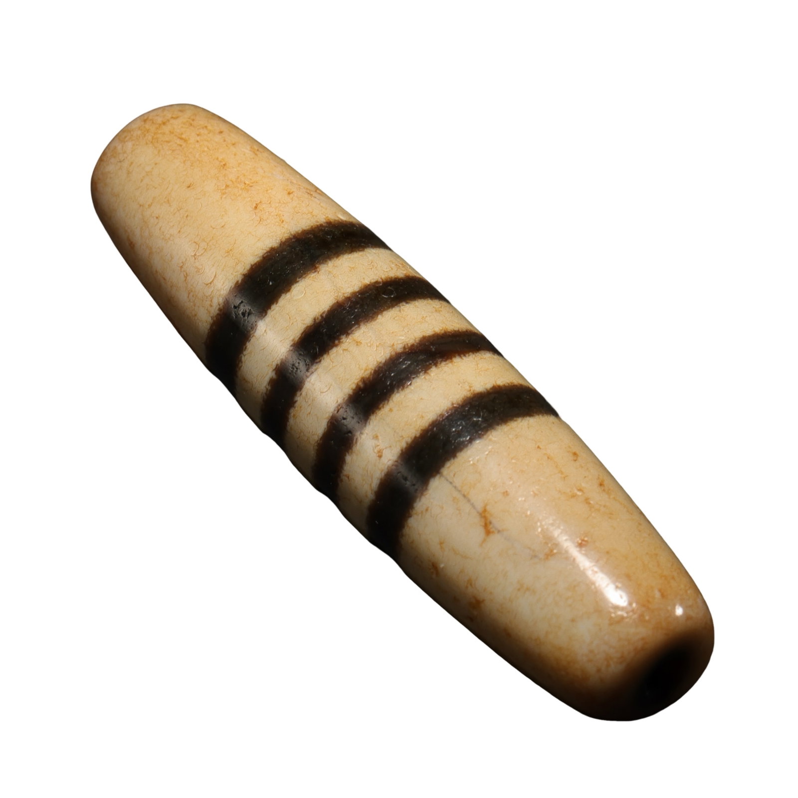 Ancient Tibetan (circa 7th–10th Century) Four-Line Medicine Buddha Dzi Bead: Dimensions: L. 4.85 cm (1.9 in.), Dia. 1.3 cm (0.5 in.), weight 13 g, 7th–10th Century?Condition & Provenance: Good condition with natural weathering, aged patina, and surface characteristics develo