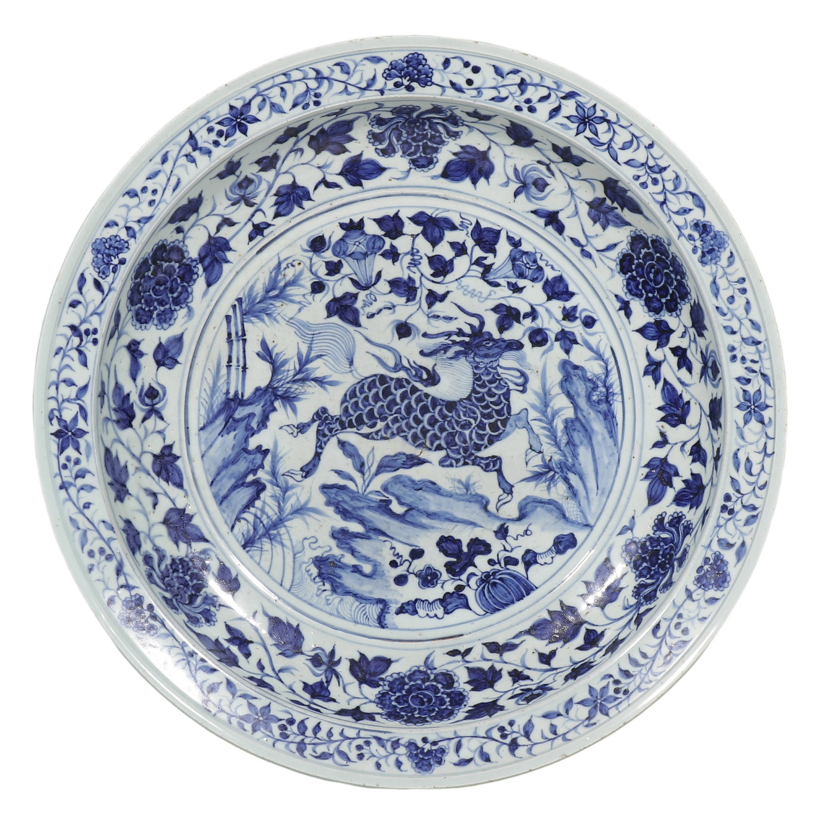 Yuan Blue?and?White Large Flared?Rim Dish with Qilin amid Rocks and Flowers: Dimensions: Diam. 45?cm (17?3/4 in), 14th?century Yuan dynasty Condition & Provenance: Condition: Fully intact, no chips, cracks or restoration. Flared rim, shallow curved body, unglazed sandy base.