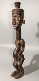 A Congolese Male Dengese Figure: This scarce obvious male figure is surely carved just north of the Kuba peoples area of former Zaire. From the Dengese, uncommon without scarification, a crisply carved example showing real tribal