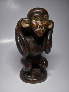 An Exceptional Cameroon Ape God 'Modello': Exceptional, a little prize, from north eastern Cameroon. This teaching tool shows strong age, a face imbued with its original lime or kaolin, the surface with a rich, dark patina and fine polish.