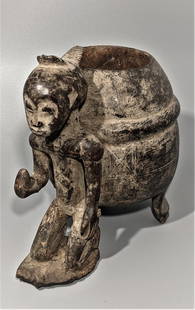 Baule Mouse Oracle Box, Ivory Coast: A well worn example of a highly desired type, A kneeling male beside the large pot, a container for a mouse from which the tribal shaman makes his predictions. Old surface with tribal wear, abstract