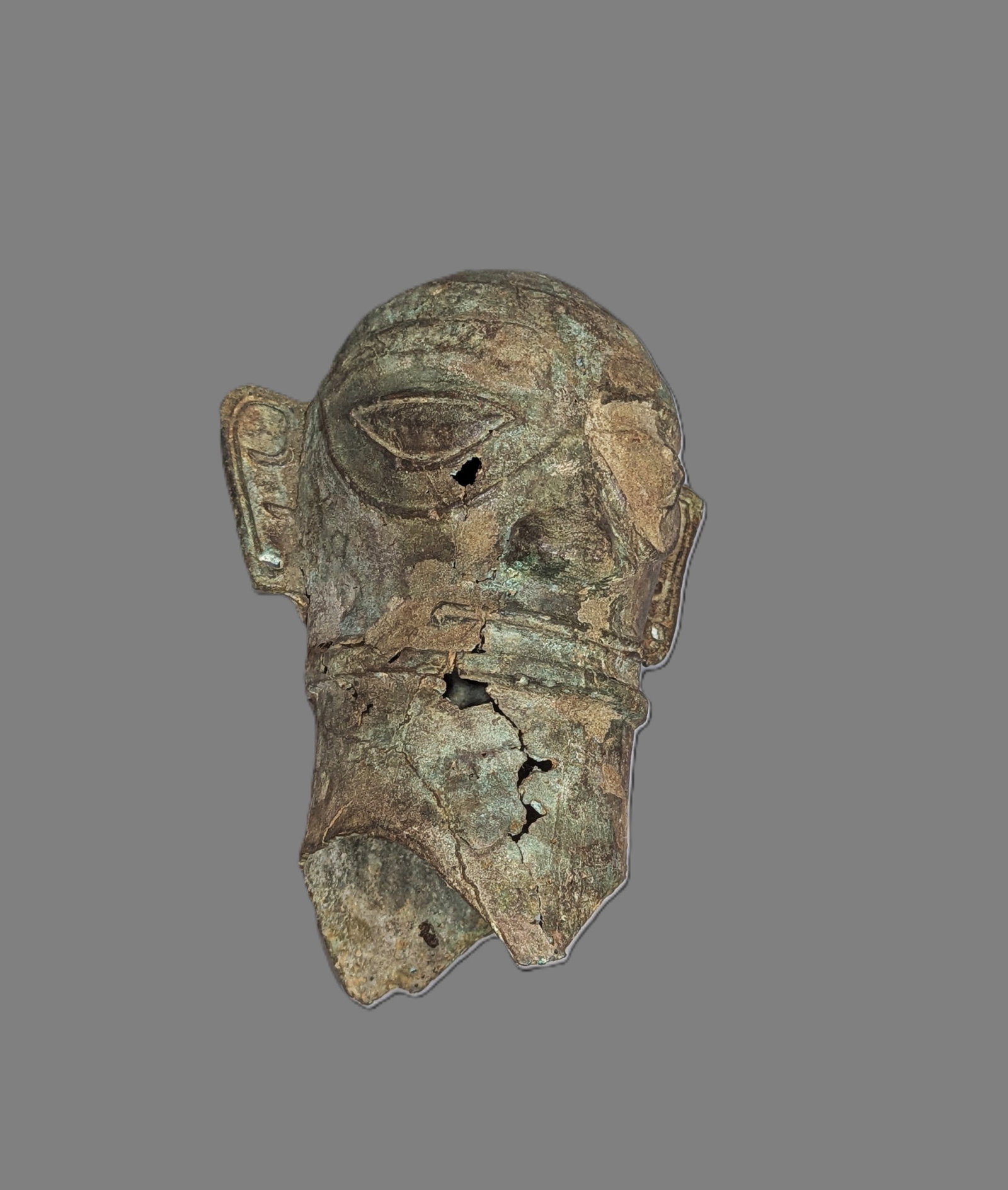 Chinese Sanxingdui-Style Bronze Head: A hollow-cast bronze head modeled in the distinctive Sanxingdui tradition, with elongated face, large almond-shaped eyes, projecting rectangular ears, prominent nose, and strongly articulated mouth. T