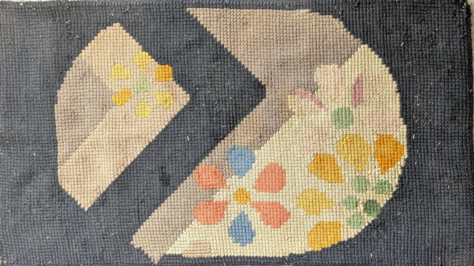 American Hand-Hooked Art Deco Floral Rug: American hand-hooked rug worked in wool or fabric loops over a burlap foundation, featuring a bold black and gray geometric composition accented with stylized pastel floral motifs. The design blends f