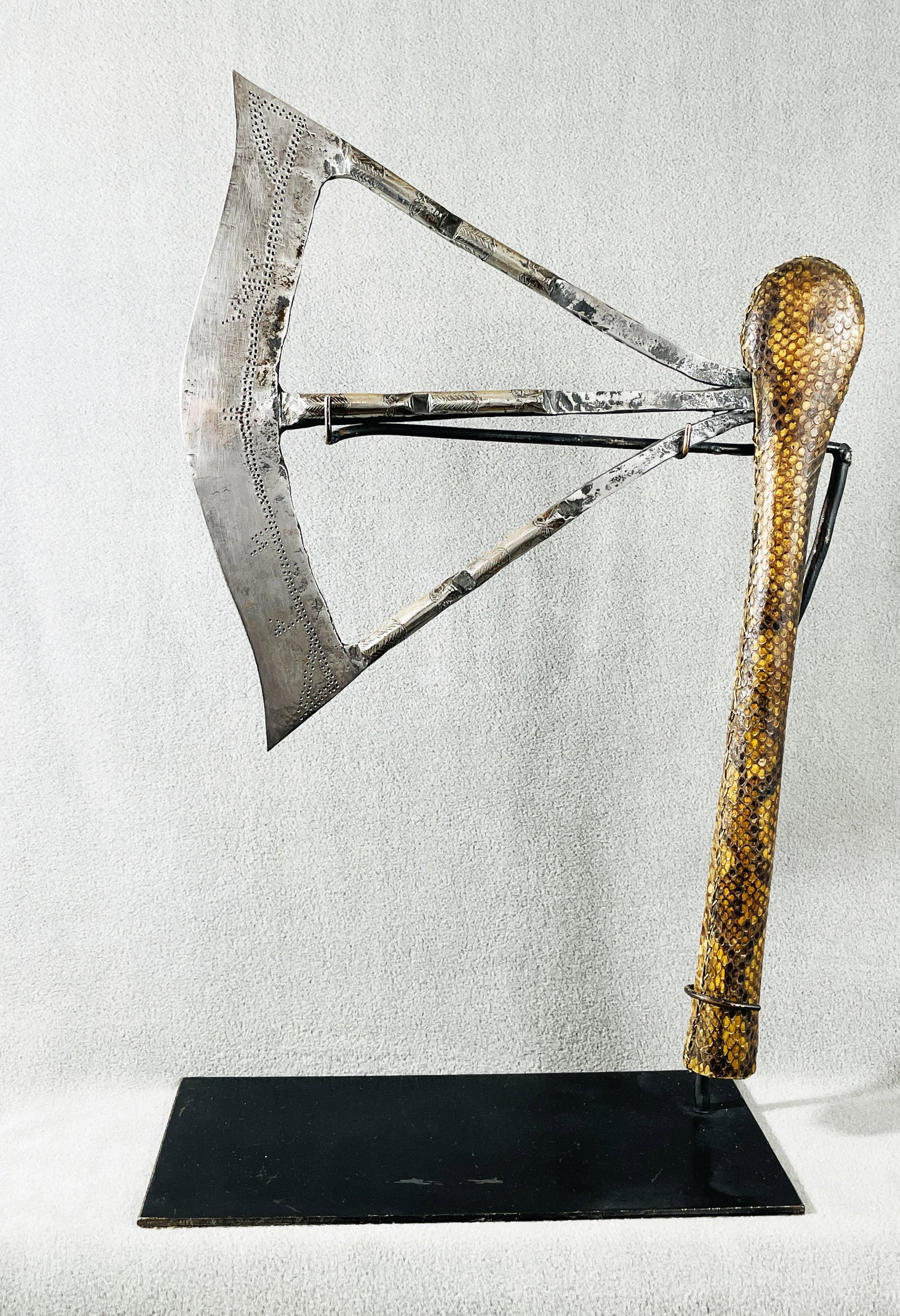 African Congo Songye Ceremonial Axe Display Included: Country of Origin: Presently Democratic Republic of the Congo (DRC); originates from the era of the Belgium Congo (1908-1960) Early 20th Century Songye ceremonial axe. Metal blade is detailed with hum