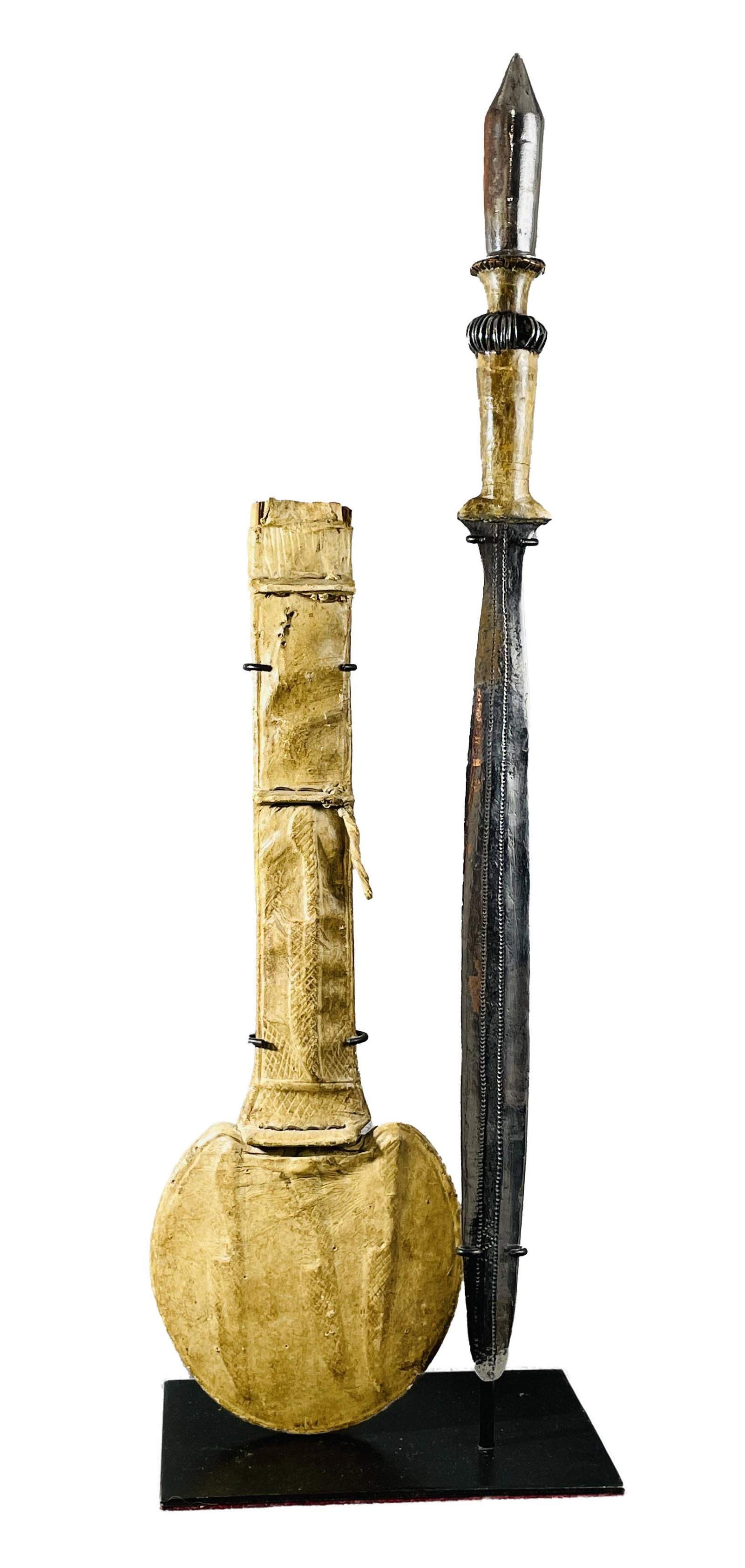 African Congo Court Sword & Scabbard Display Included: Country of Origin: Presently Democratic Republic of the Congo (DRC); originates from the era of the Belgium Congo (1908-1960) Early 20th Century sword & scabbard, possibly Kawanda. Hand-forged metal b