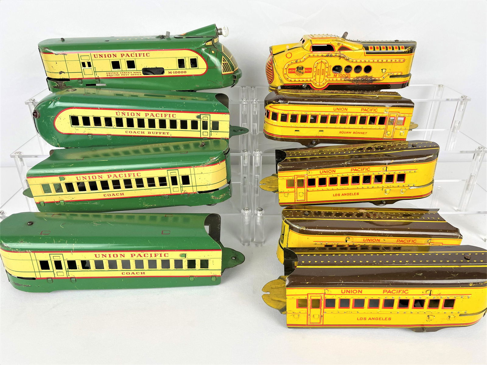 Two Marx 1930s/40s Union Pacific Train Sets: Two vintage 1930s/40s Marx O scale Union Pacific train sets including an electric M10000 Streamline set with engine and three cars and a wind-up Union Pacific M10005 set with engine and four cars. Not