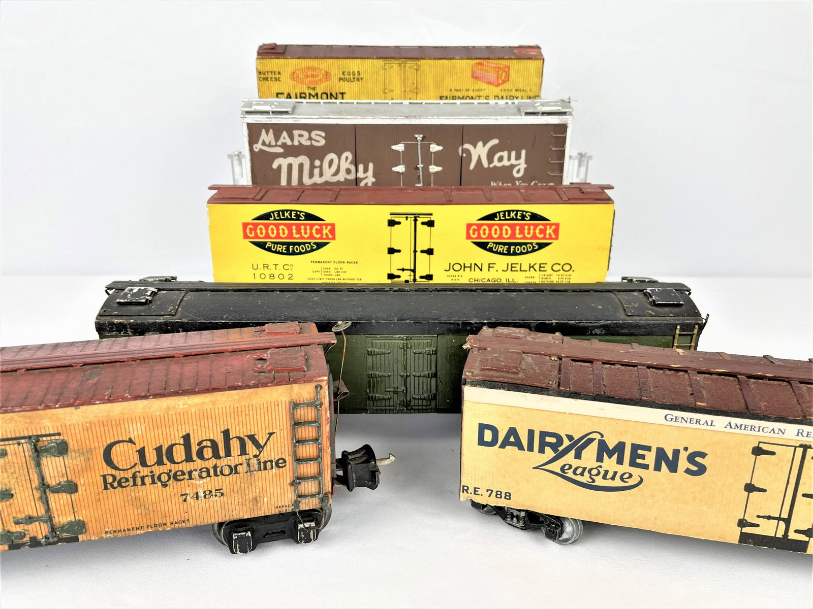 Group Westbrook Wood Train Box Cars: Group of six (6) vintage, likely c.1940s from Westbrook kits, wooden box cars with vintage advertising including Fairmont Creamery, Jelke's Good Luck Pure Foods, Old Dutch Cleanser, Dairy Men's League