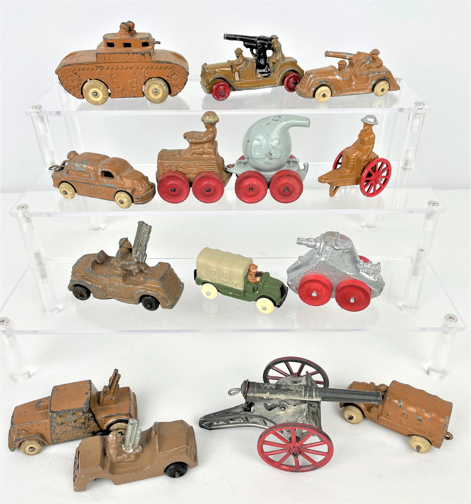 Vintage Barclay Army Vehicles: Vintage Barclay Manoil Army vehicles including a tractor with gas bomb trailer, tank, fighting vehicles and more. Vintage wear including paint loss as seen. Some pieces may have overpainting. See phot