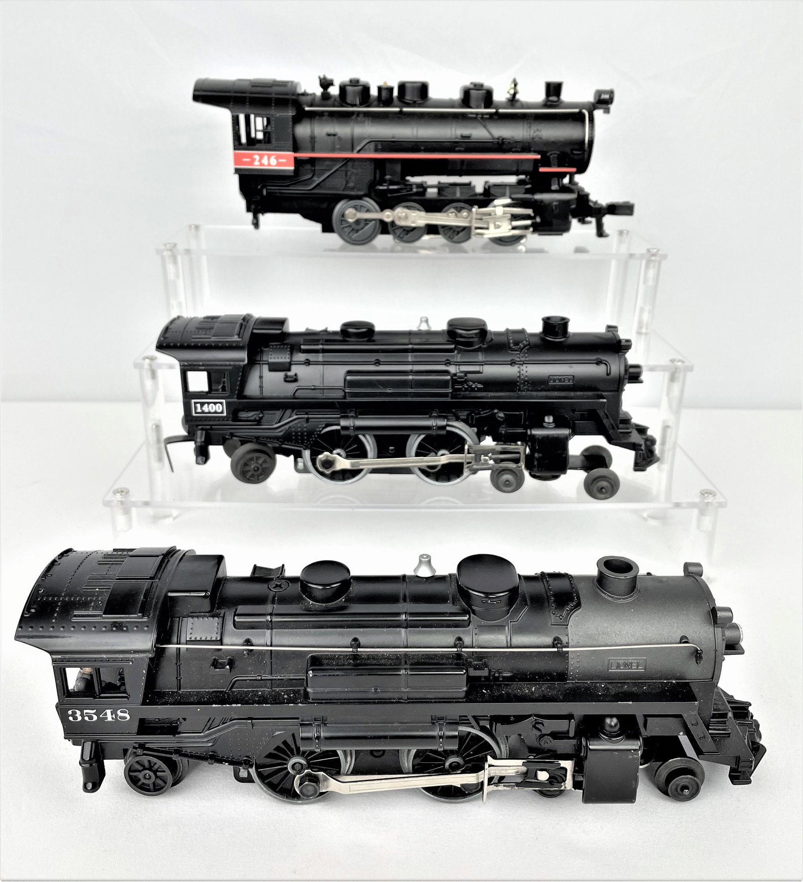 Three Lionel Engines 3548 246 & 1400: Three Lionel O scale engines including 3548, 246, & 1400. Untested. Lighter vintage wear. See photos for condition details.