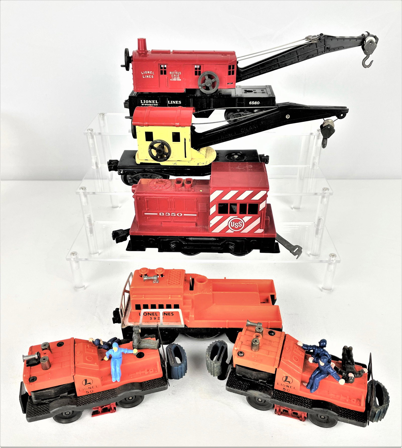 Group Lionel Train Support Vehicles: Group of six (6) Lionel train support vehicles including a 3927 track cleaning car, (2) 50 gang cars with figures, 8350 switcher, 2560 metal crane, and 6560 crane. Untested. Vintage wear. See photos f
