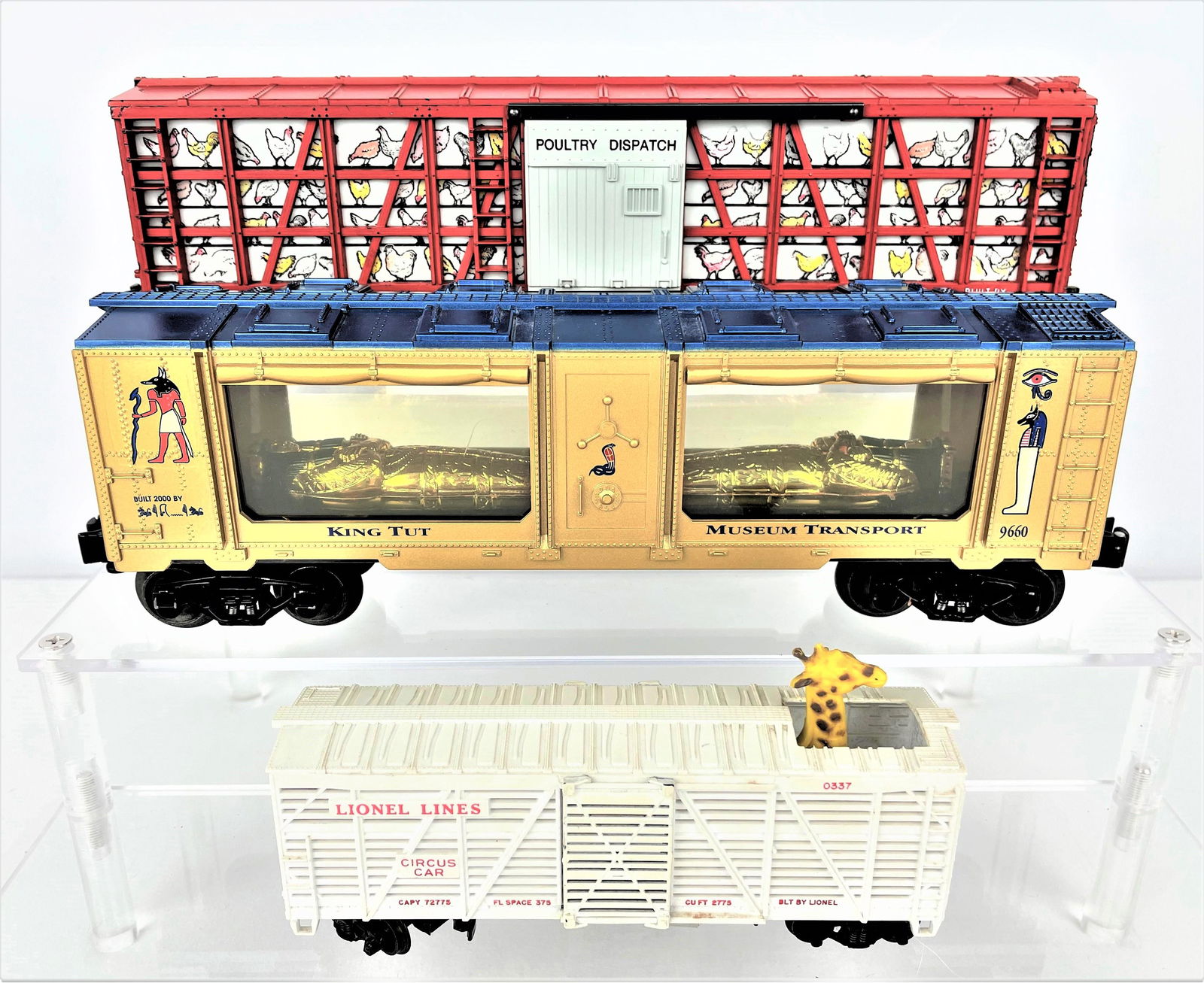 Three Unique Lionel Train Cars King Tut Circus: Three unique Lionel locomotive train box cars including a 9660 King Tut Museum Transport, a 0337 Circus Car with a giraffe poking out from the top, and a 6434 Poultry Dispatch car. Untested. Light vin