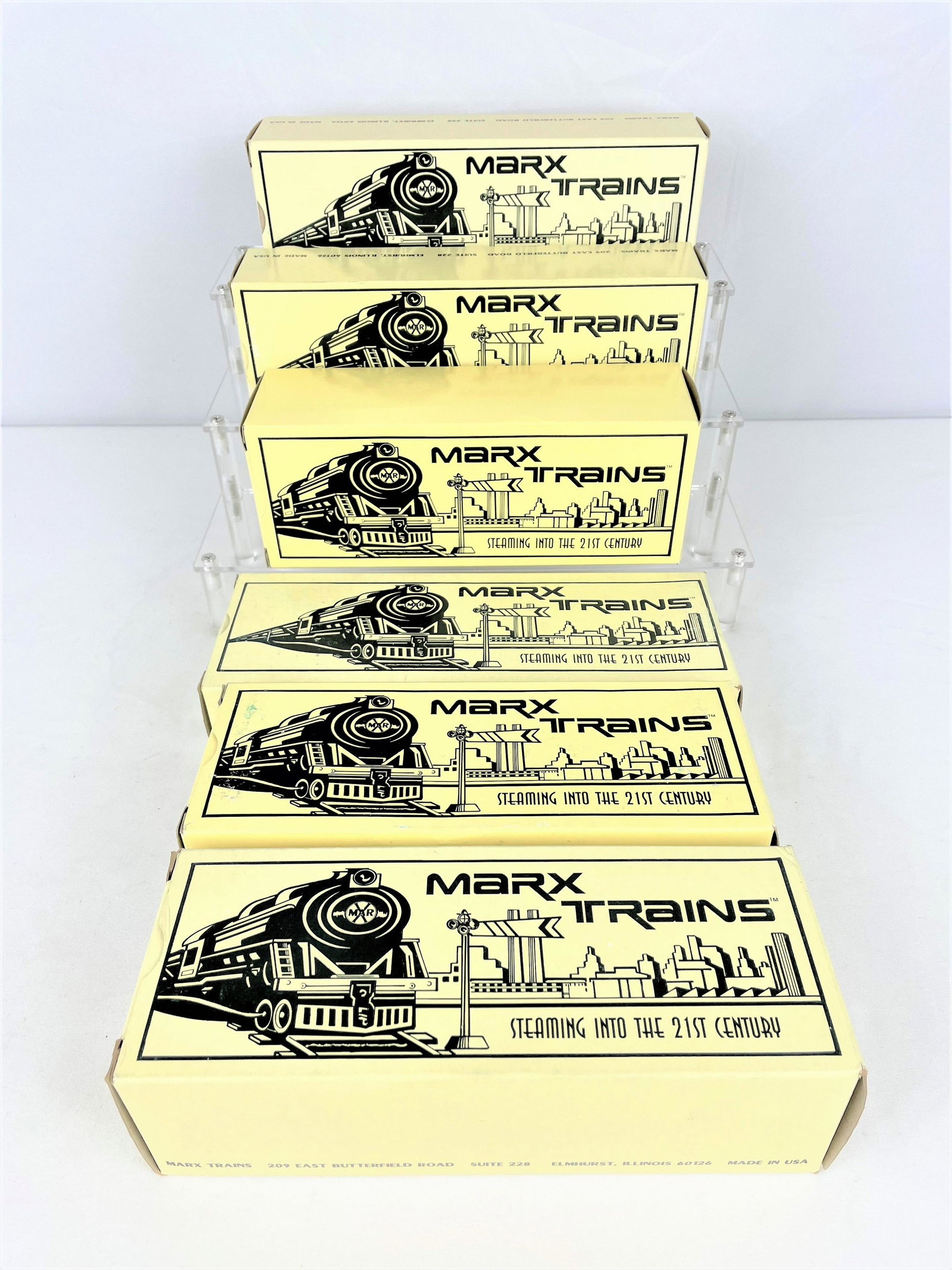Group Modern Marx Trains: Group of six (6) Modern Marx trains in original boxes including 7675-4 Wht Mountain, 7385 Drewrys, 72000Toy Fair Commemorative Boxcar, 7264 Action Toys Car, 7373-P Burlington Scale Stock Car, 4484-8 A