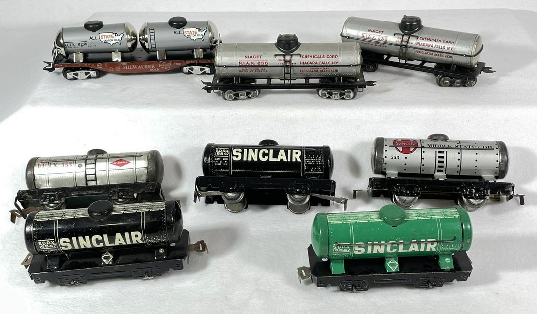 Group Marx Tin Metal Tanker Cars: Group of eight (8) Marx tin metal locomotive tanker cars including Sinclair, All State, Niacet Chemicals Corp., and more. Vintage to contemporary. Vintage wear on vintage pieces. See photos for condit