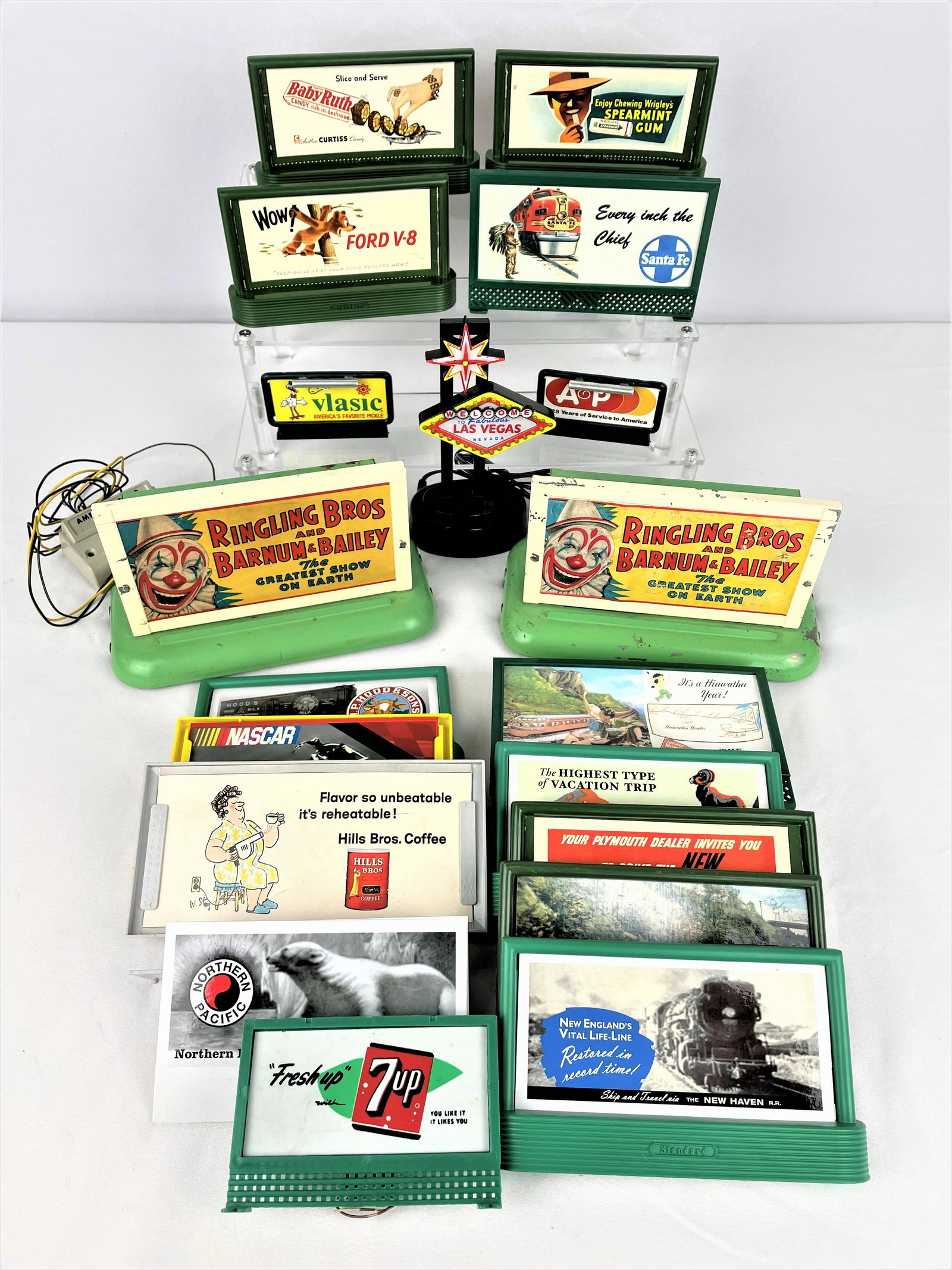 Large Group Railroad Billboards & Signs: Large group of railroad billboards & signs including two vintage metal AC Gilbert American Flyer Ringling Brothers Circus billboards, a Welcome to Las Vegas Led sign, and approx fifteen plastic billbo