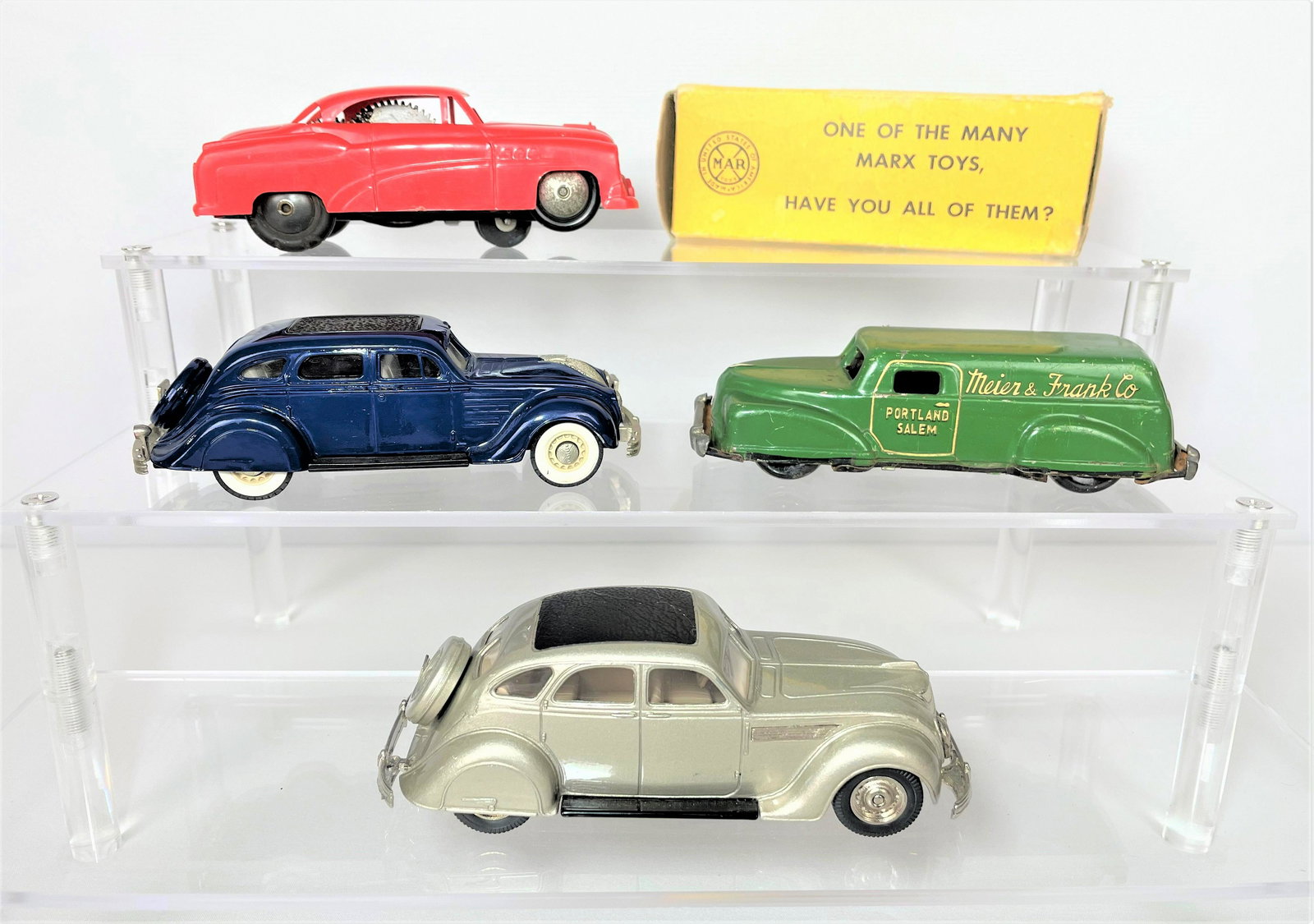 Toy Cars Brooklin Rex Toys Marx: Group of four (4) collectible toy cars including Brooklin Models 1934 Chrysler, Rex Toys Chrysler 1935 Touring Sedan, Marx wind-up No. 6520 Buick in original box, and a tin litho Meier & Frank promoti