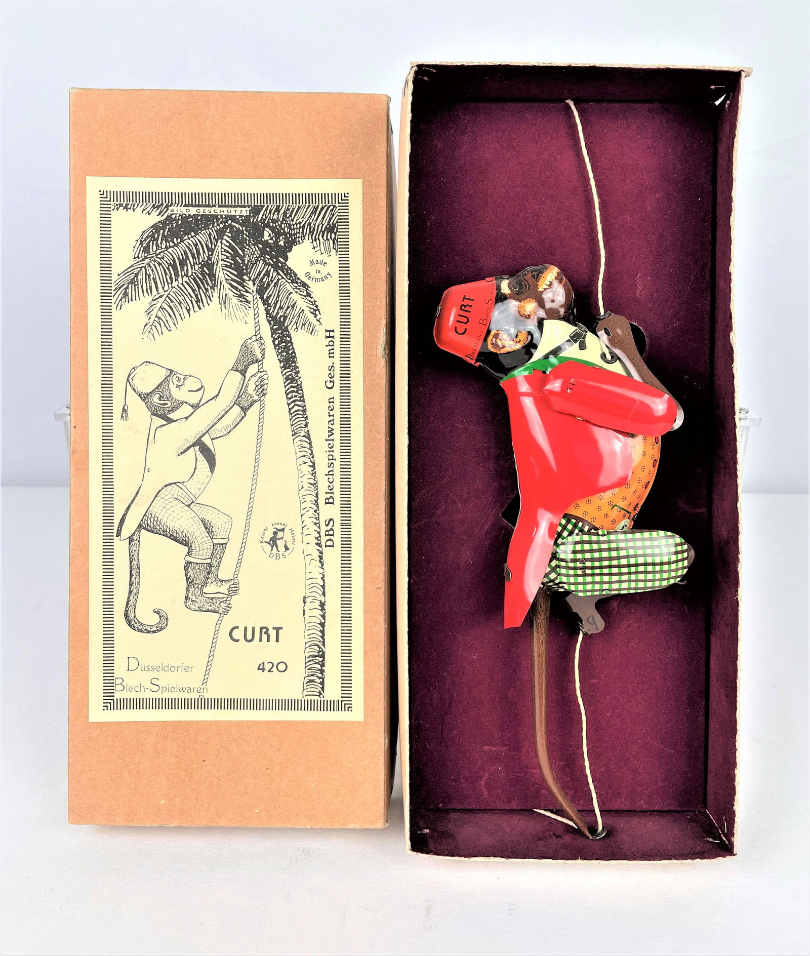 German DBS Mechanical Curt Toy Monkey: Vintage German mechanical tin toy rope climbing monkey No 420 named "Curt" by Susseldorfer Blech-Spielwaren. Original felt lined box and insert written in both English & German. Does not appear to hav