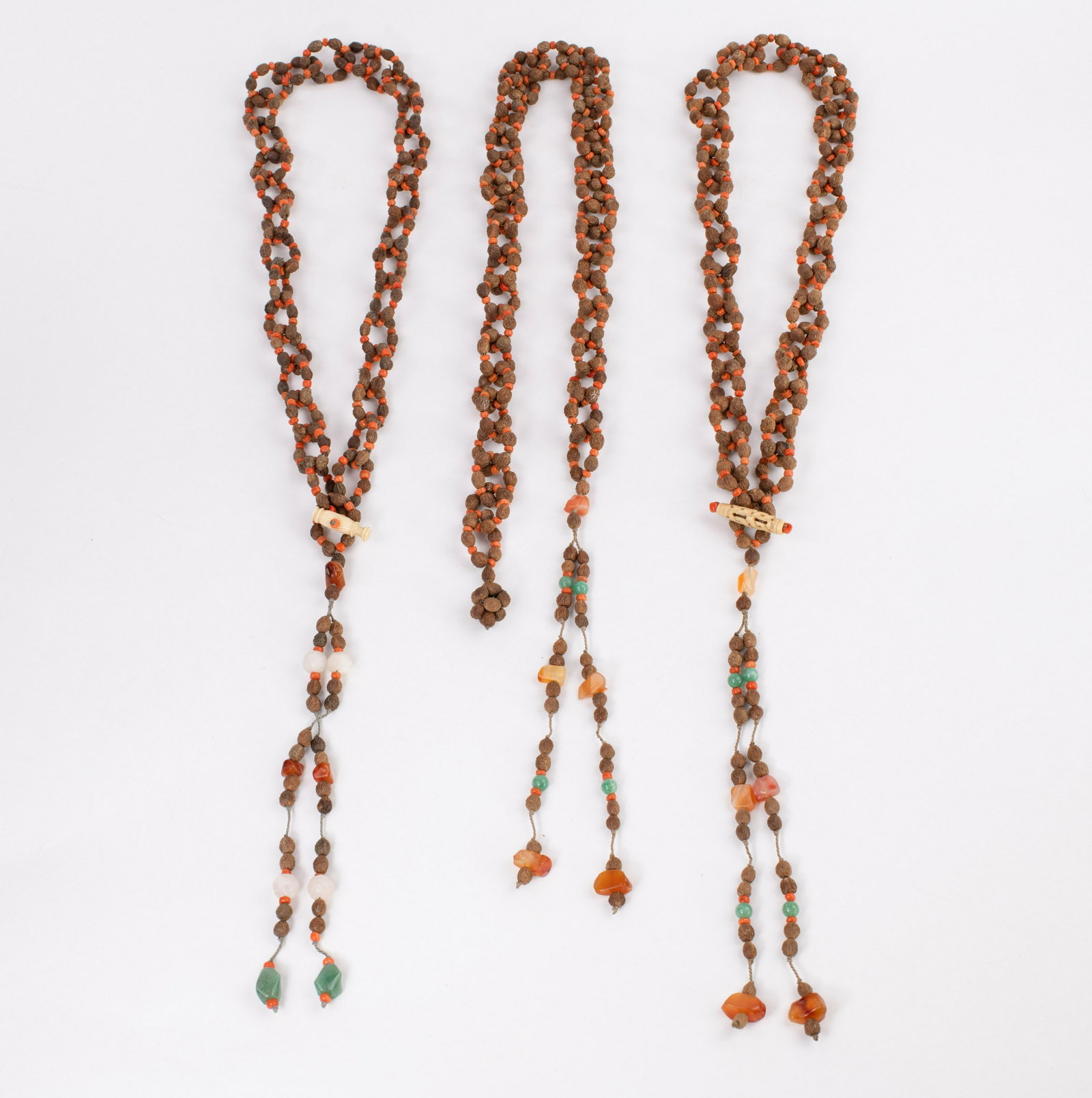 Vtg Chinese Beaded Necklace Strands Carnelian Seed Pods Jade: Three vintage Chinese beaded necklace strands with carnelian, jade, and semi-precious stone beads, seed pods, and bone toggle closures. Each measure approx. 35" long with tassle. Total weight 7.9oz SH