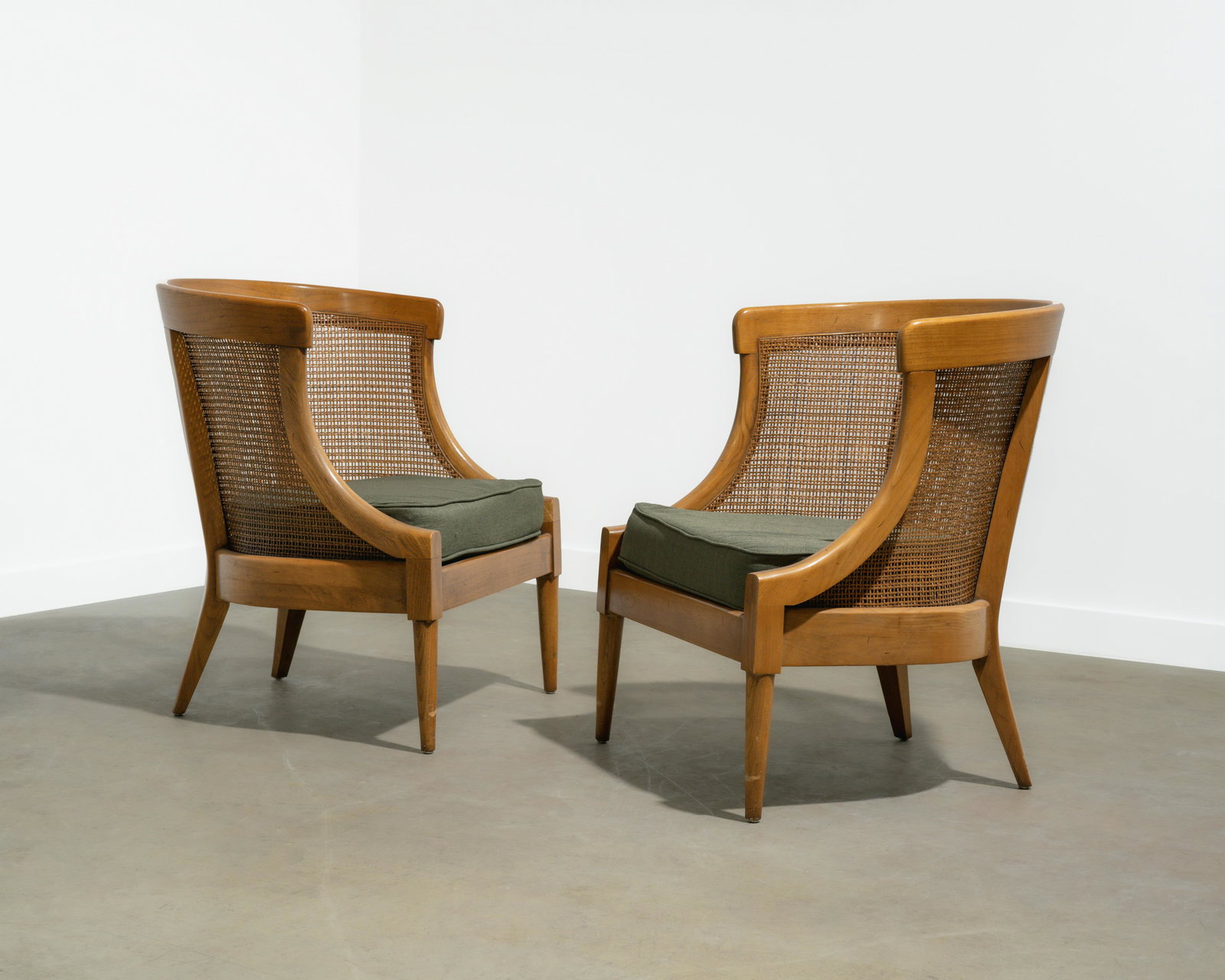 Barrel Back Cane Club Chairs: A pair of barrel back, caned lounge chairs. 29 x 25.5 x 21.5. All measurements are in inches.