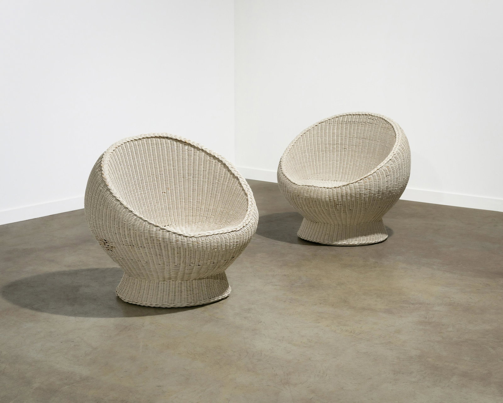 Wicker Pod Chairs: A pair of vintage wicker pod chairs. Dimensions : 30 x 32 x 31. All measurements are in inches.