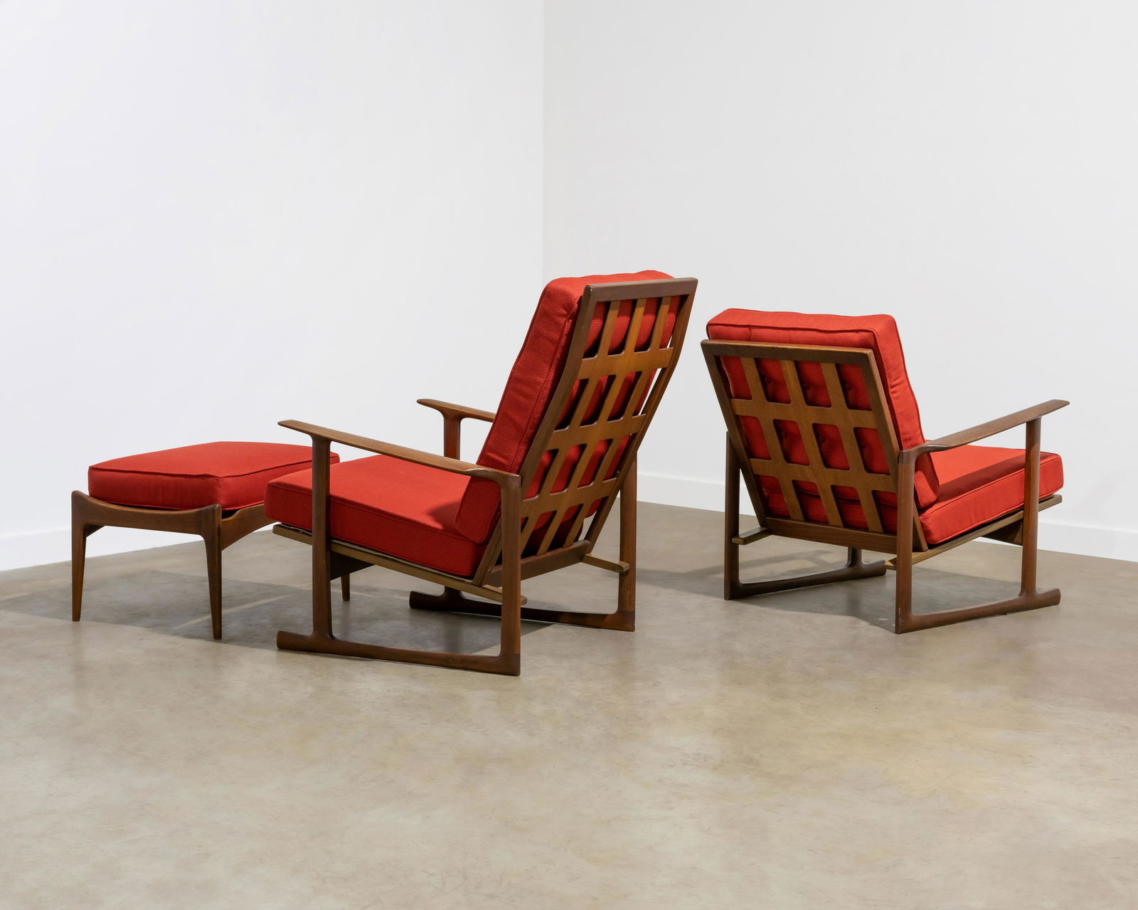 Kofod Larsen - Sled Lounge Chairs: A his and hers set of sled chairs with matching ottoman by Kofod Larsen for Selig with a unique latticed back. His - 36 x 19 x 31 / Her's - 28 x 19 x 30 . All measurements are in inches.