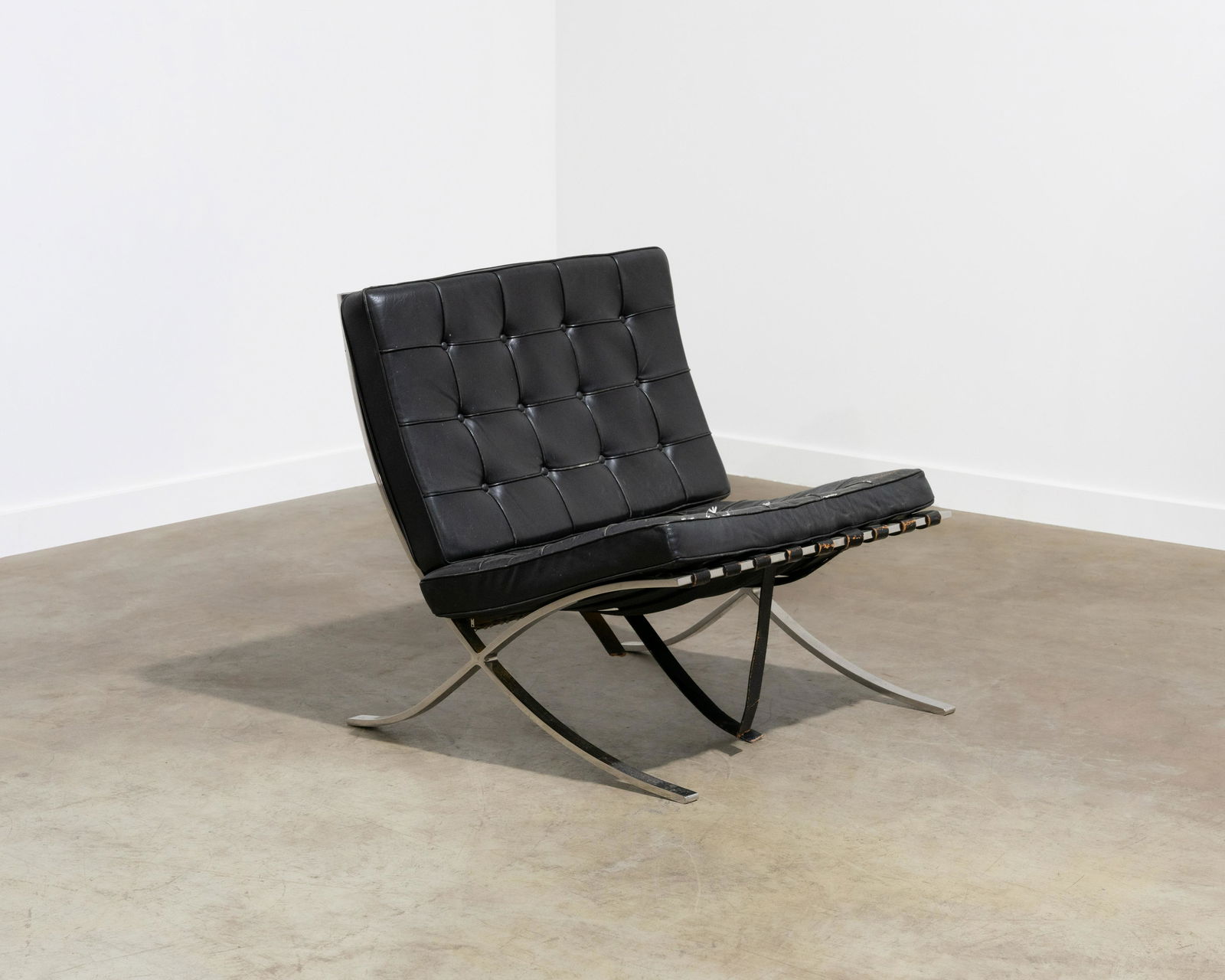 Mies Van Der Rohe - Barcelona Chair: A vintage Mies Van Der Rohe "Barcelona" chair for Knoll. Label on underside. Dimensions : 29.5 x 30.5 x 30. All measurements are in inches.