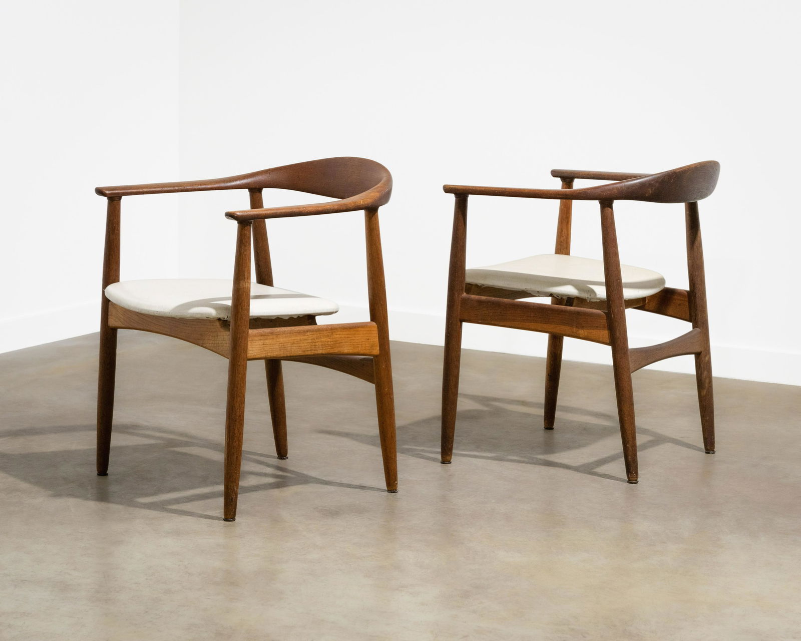 Danish Armchairs: A pair of armchairs in the manner of Carl-Axel Acking.. Dimensions : 29.75 x 24 x 23. All measurements are in inches.