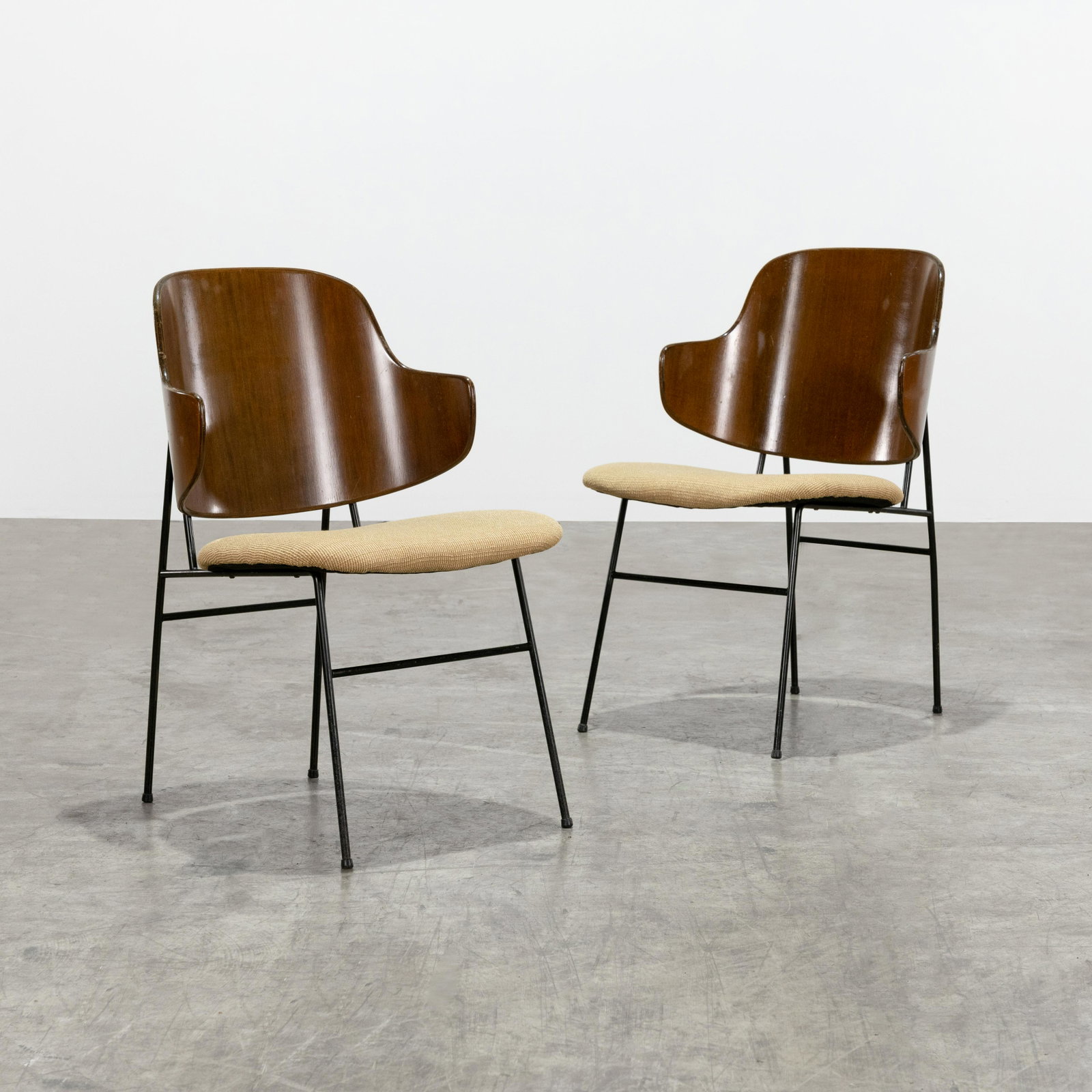 Kofod Larsen - Penguin Chairs: A pair of Kofod Larsen "Penguin" chairs. Marked "Made in Denmark" on underside of backrest. 32 x 21 x 24 . All measurements are in inches.