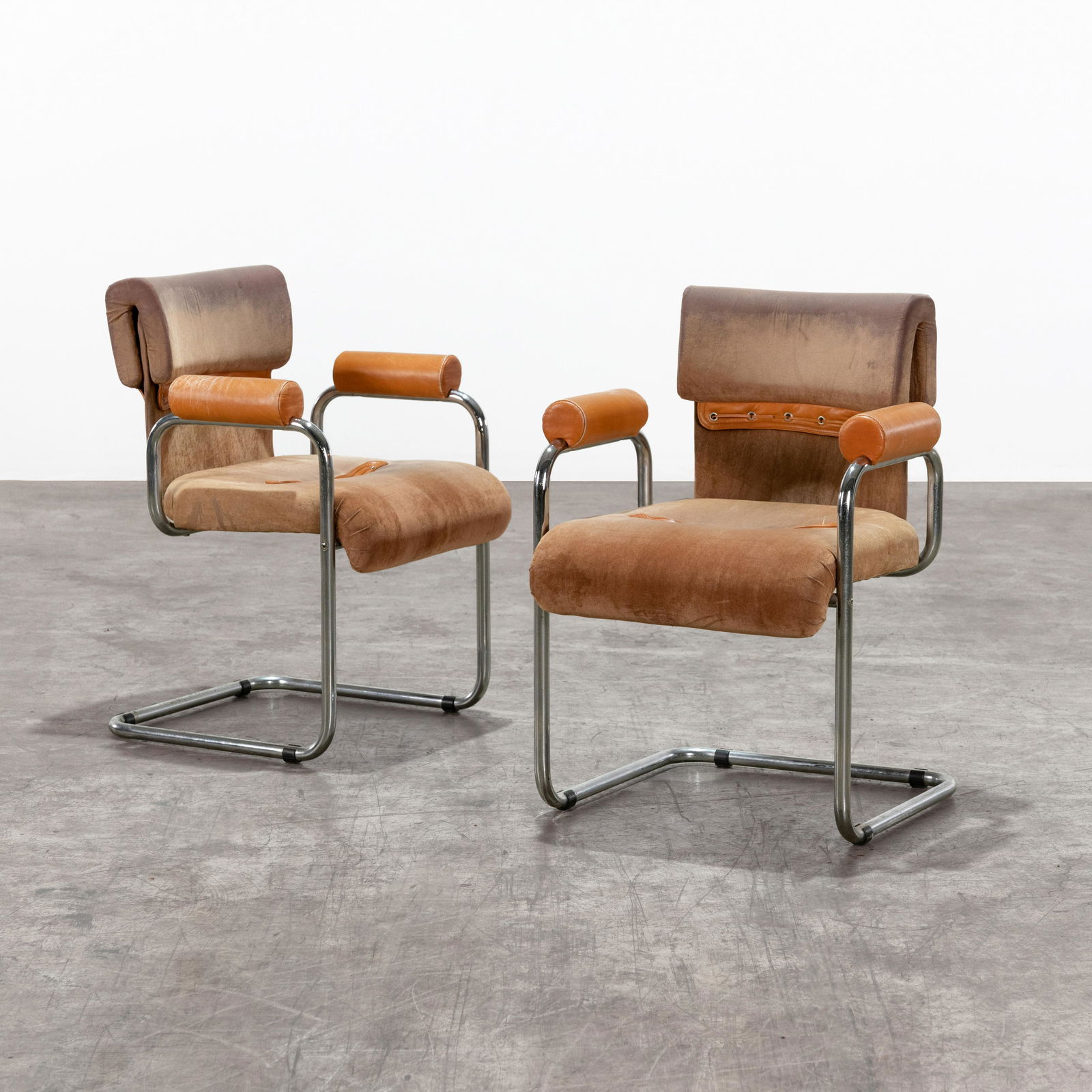 Guido Faleschini - Tucroma Chairs: A pair of "Tucroma" chairs in leather by Guido Faleschini for Mariani , Pace Collection. 30.5" x 23.5" x 24" . All measurements are in inches.