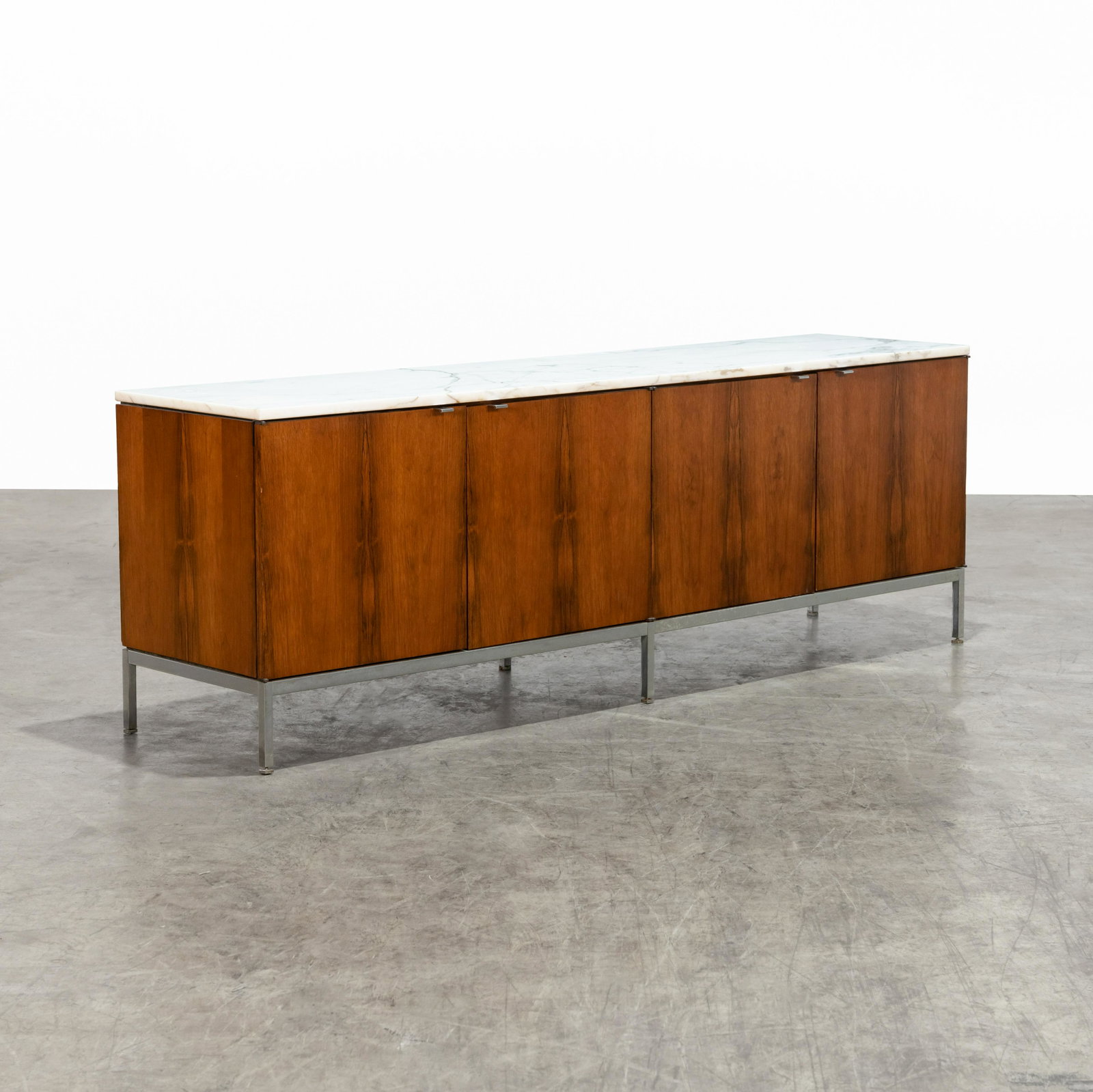 Florence Knoll - Rosewood Credenza: A Florence Knoll rosewood and carrara marble credenza. 26 x 75 x 18 . All measurements are in inches.