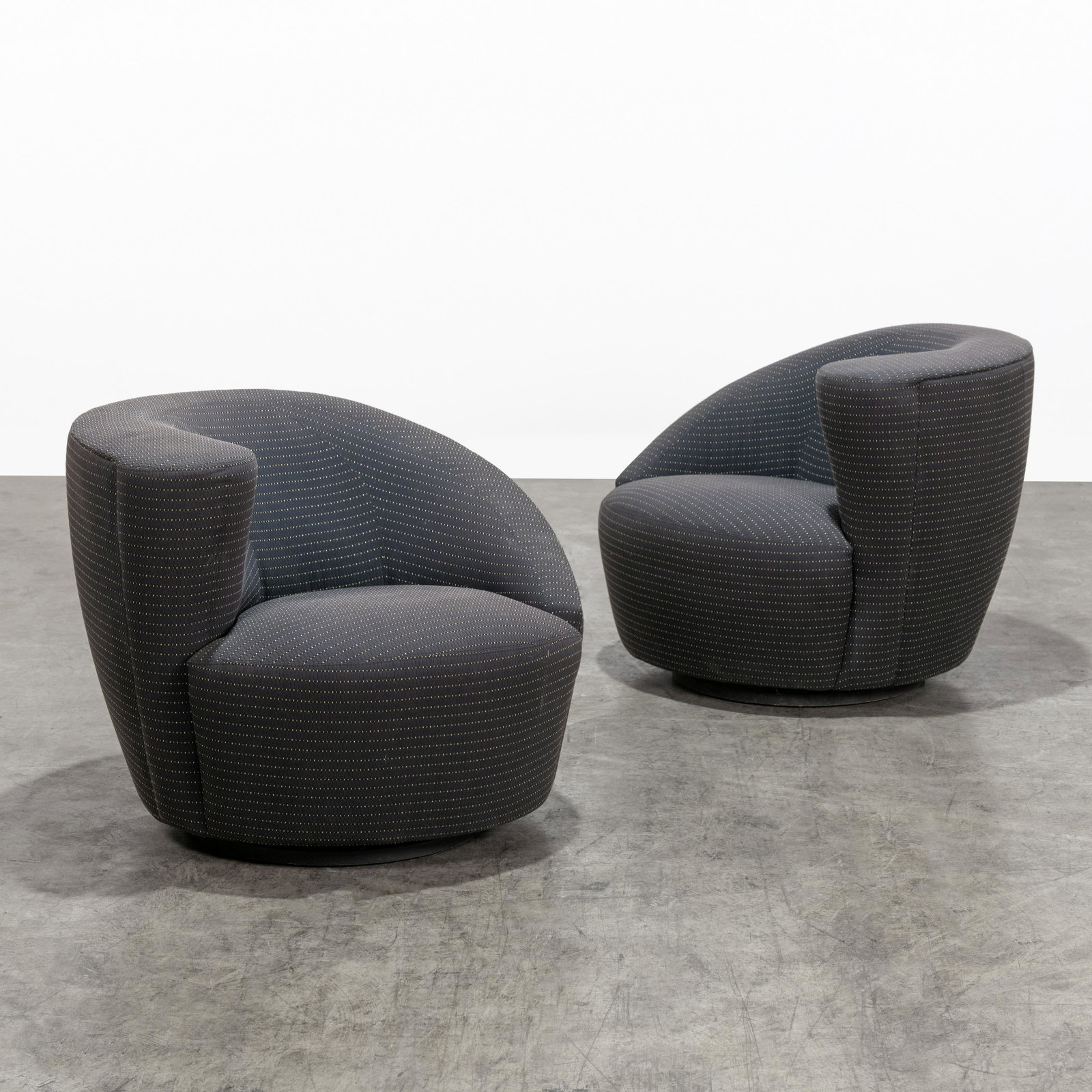 Vladimir Kagan - Swivel Chairs: A pair of swivel chairs by Vladimir Kagan for Weiman. Label on underside. 29.5 x 37 x 37 . All measurements are in inches.