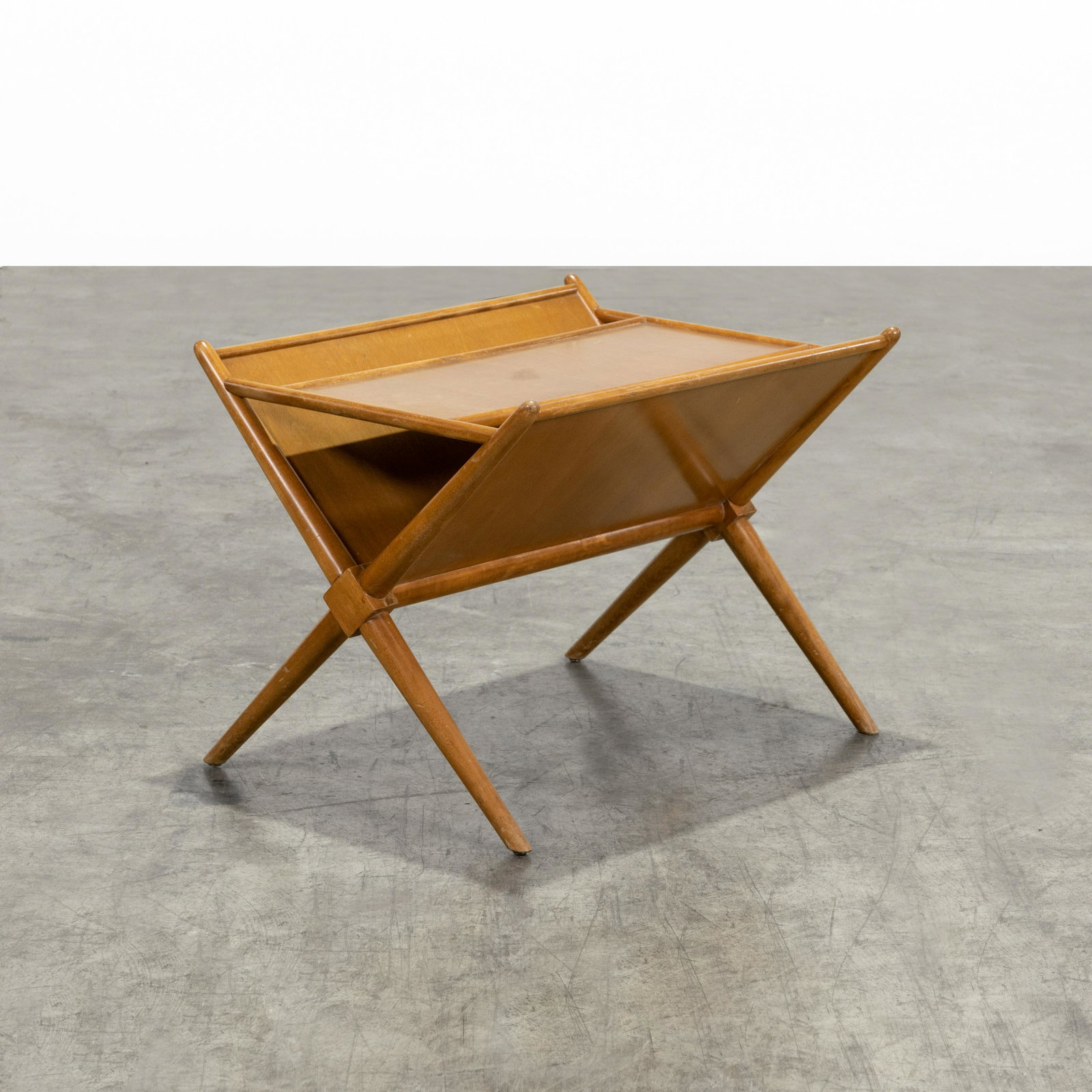 T. H. Robsjohn Gibbings - Magazine Stand: A vintage magazine stand by T. H. Robsjohn Gibbings for Widdicom. 23 x 23.5 x 29