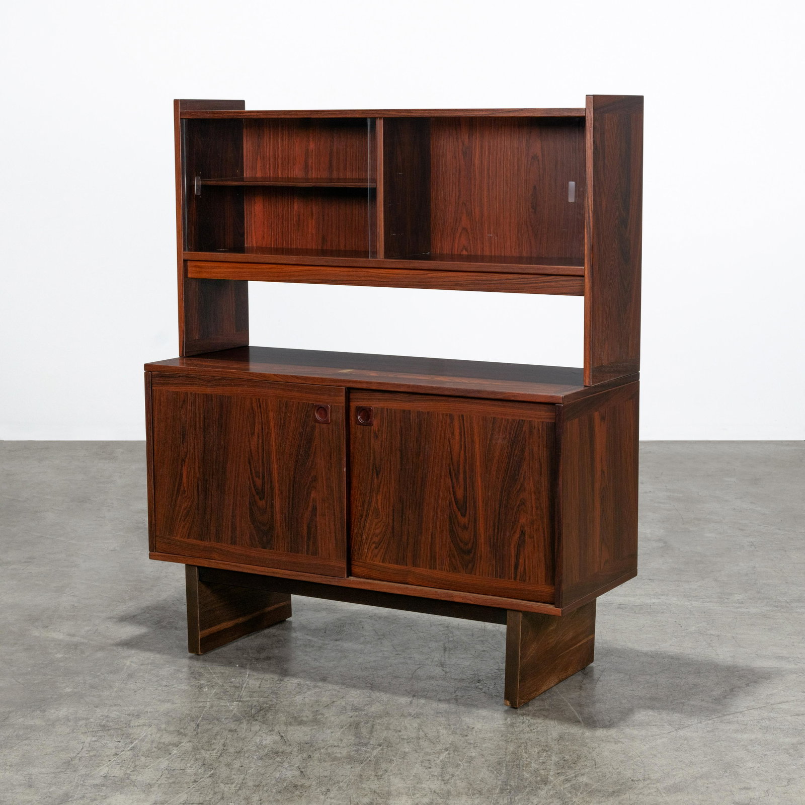 Danish Rosewood Cabinet: A vintage Danish rosewood two part cabinet. 57 x 47.5 x 18