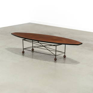 Surfboard Coffee Table: An unsual surfboard form coffee table with ball feet. In the manner of Albert Larsson and Greta Magnusson Grossman. 13.5 x 62 x 20 . Measurements are in inches. (Height x Width x Depth)