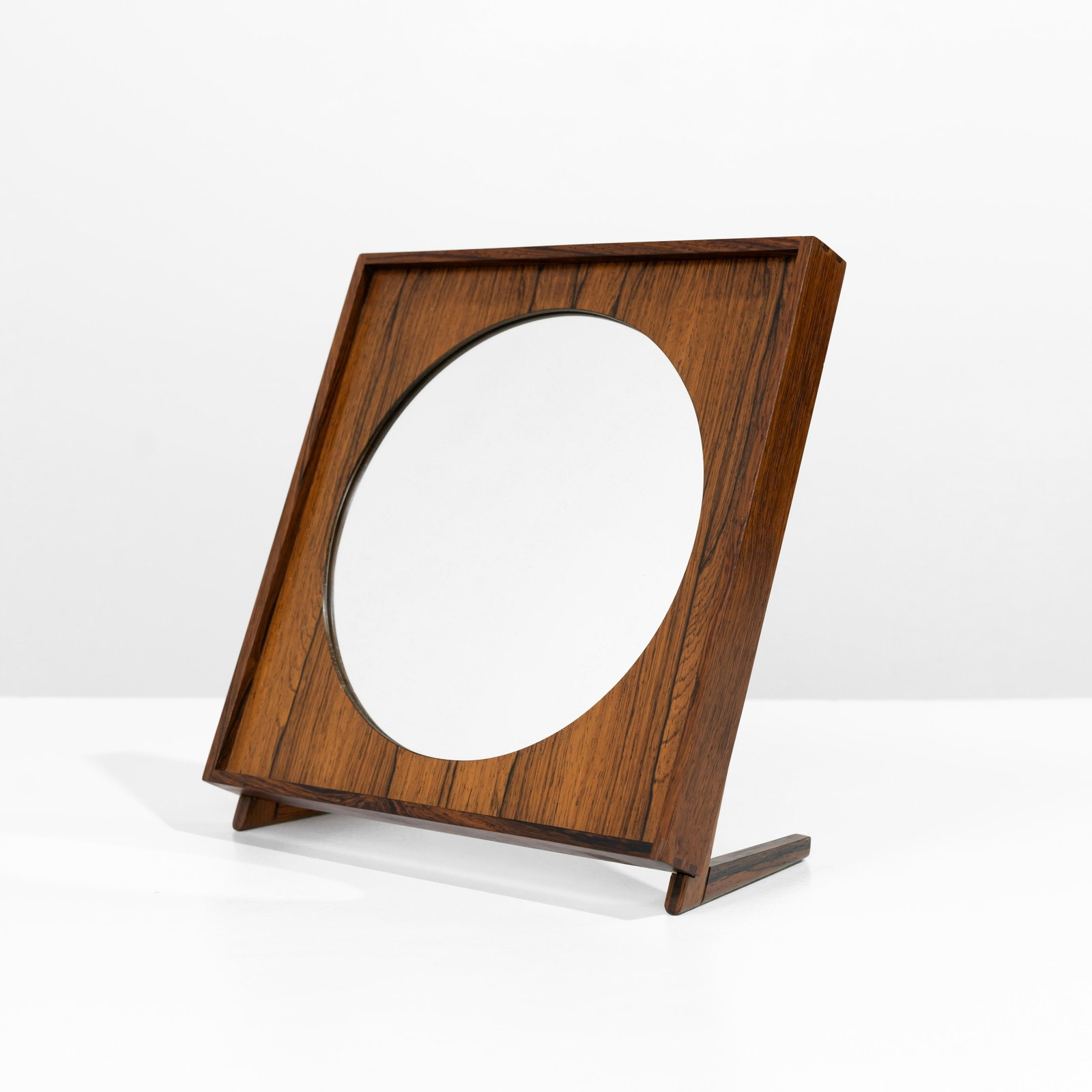 Uno & Osten Kristiansson - Table Mirror: A rosewood table mirror by Uno and Osten Kristiansson for Luxus Vittsjo. Unmarked. 12.5 x 12 x 6 . Measurements are in inches. (Height x Width x Depth)