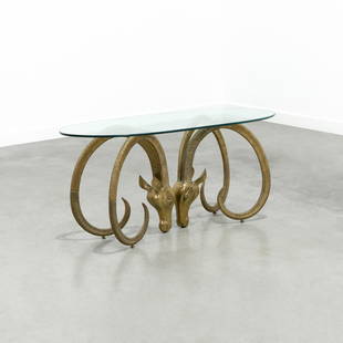 Alain Chervet Style - Brass Ibex Coffee Table: A vintage brass ibex and glass coffee table in the manner of Alain Chervet. 20 x 46 x 20 . Measurements are in inches. (Height x Width x Depth)