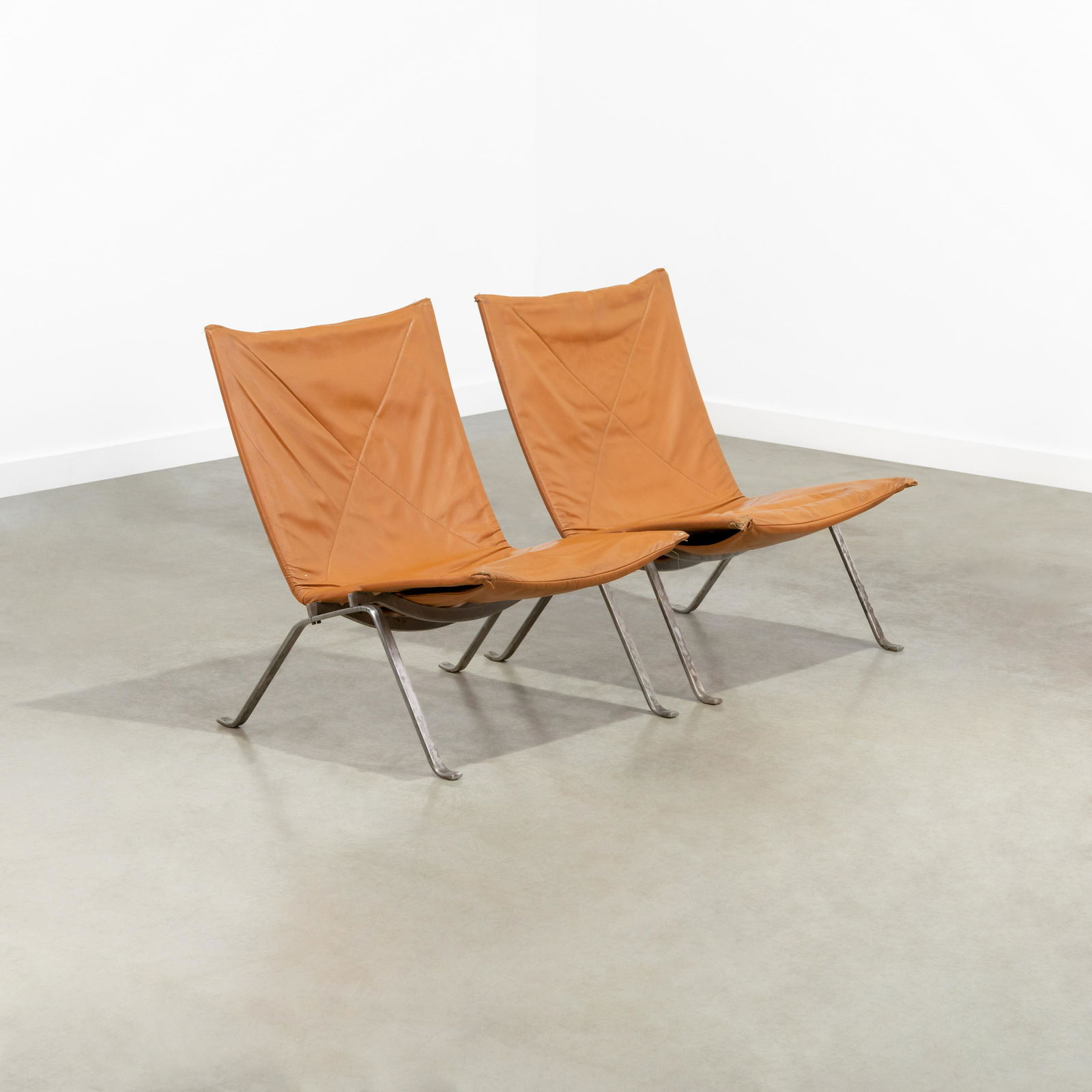 Poul Kjaerholm - PK22 Lounge Chairs: A pair of PK22 lounge chairs by Poul Kjaerholm for E. Kold Christensen. Stamped on frame. 29 x 24 x 30 . Measurements are in inches. (Height x Width x Depth)