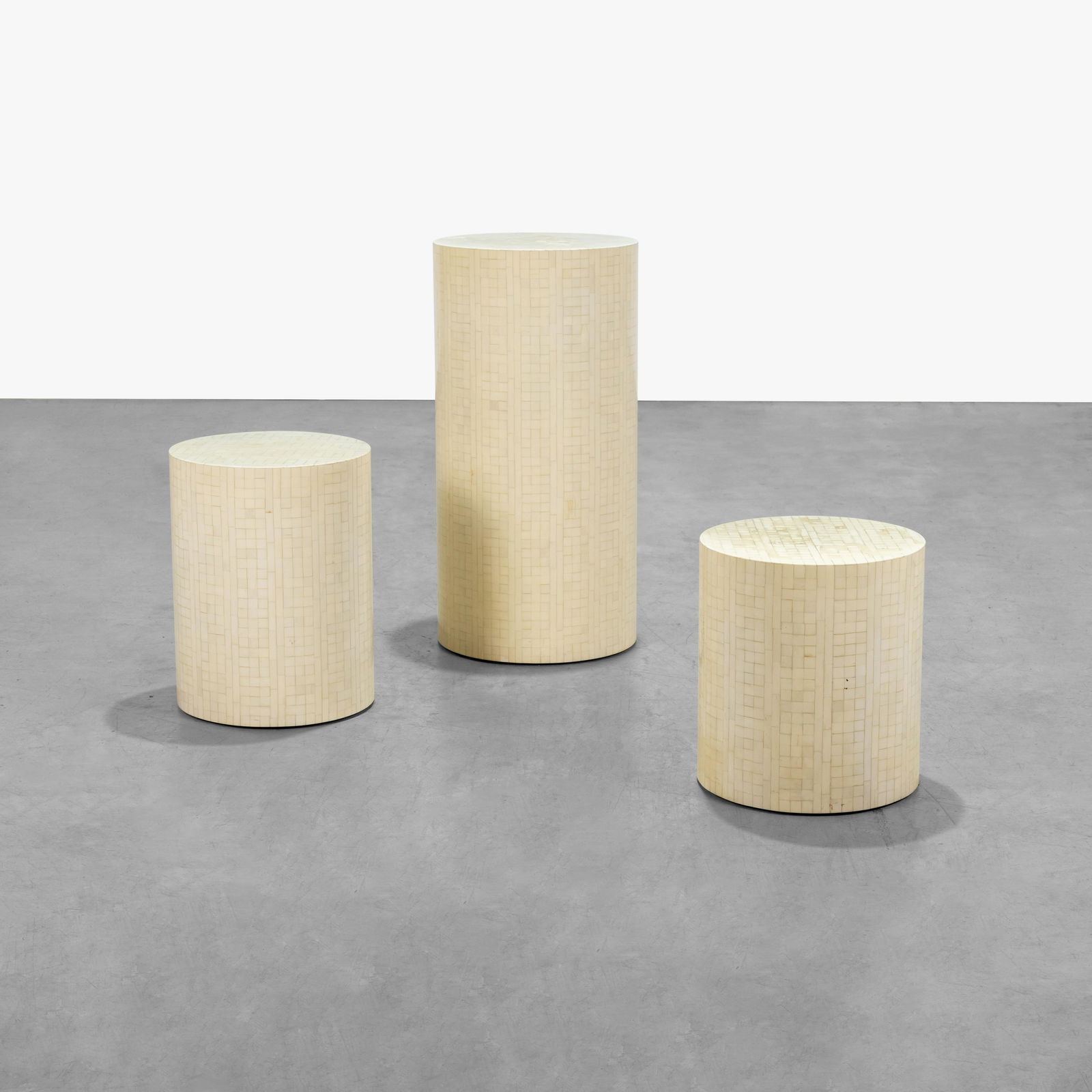 Enrique Garcel (After) - Graduated Pedestals: A set of three bone tiled pedestals in the manner of Enrique Garcel. Stamped "Made in Columbia." Large - 36 x 18 / Medium - 21 x 16 / Small - 18 x 16 . Measurements are in inches. (Height x Width x De